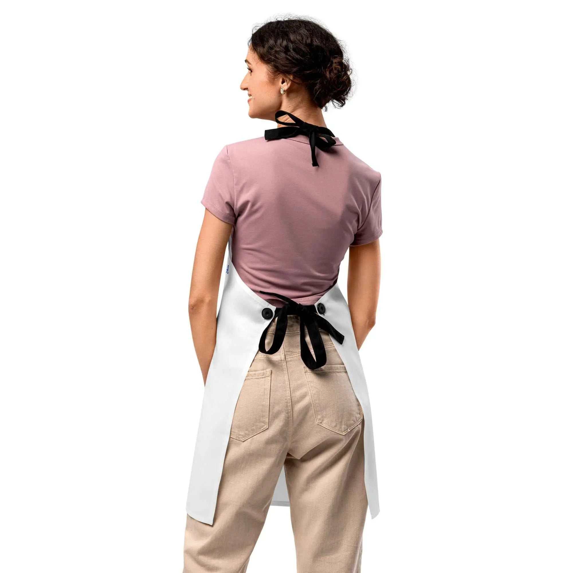 Back view of a person wearing a white Caregiver Apron Alzheimer's Awareness with black ties