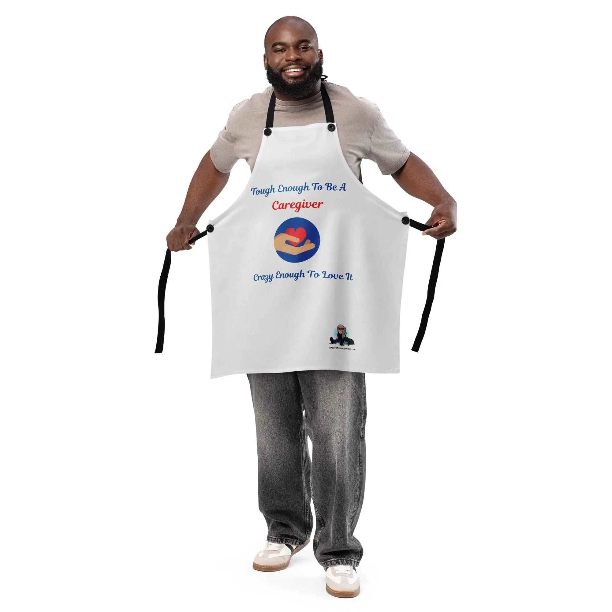 Man wearing a white Caregiver Alzheimer's Awareness apron with a heart in hands graphic and text