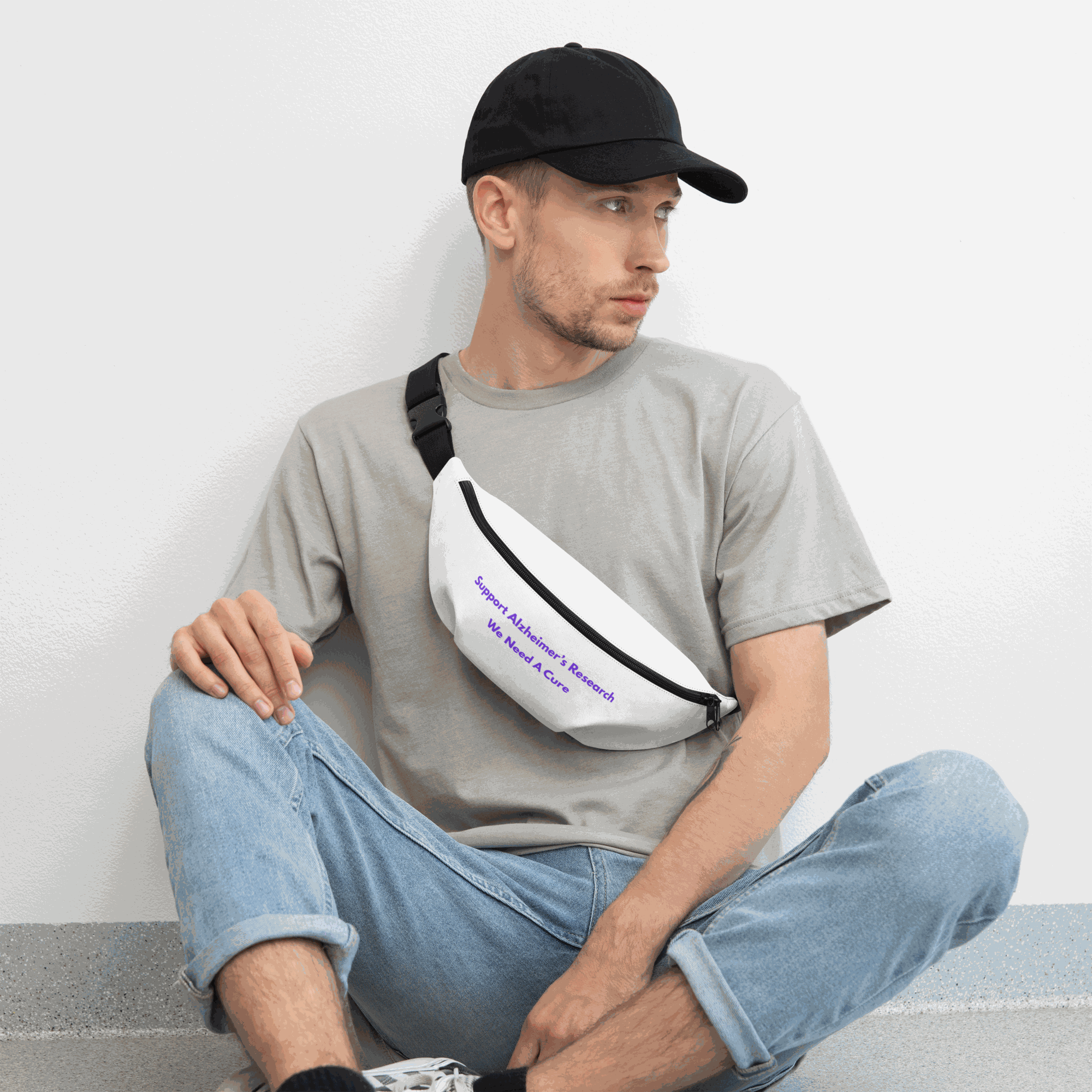 Man wearing a white Alzheimer's awareness fanny pack across his chest