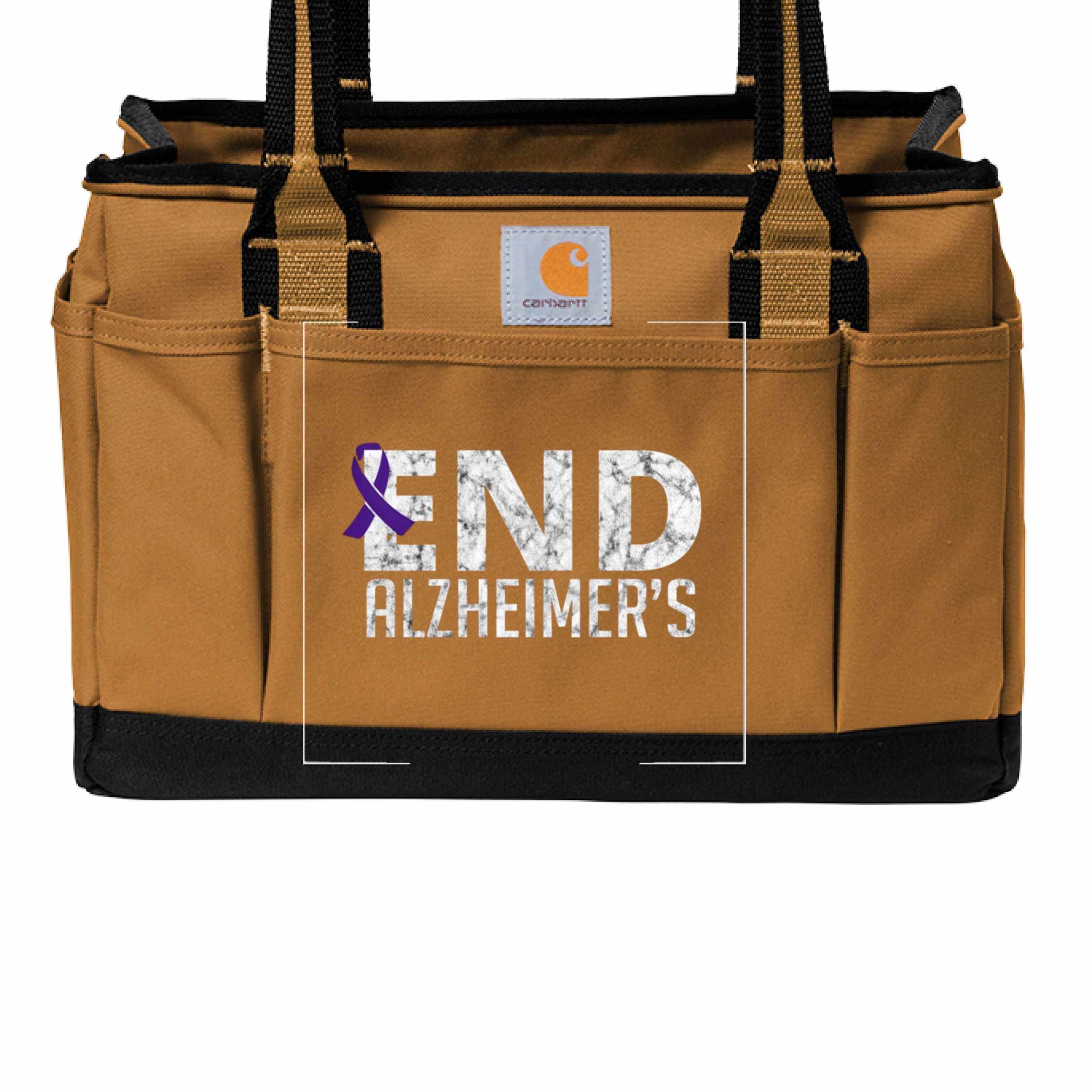 Carhartt utility tote bag in brown with End Alzheimer's text and purple awareness ribbon graphic