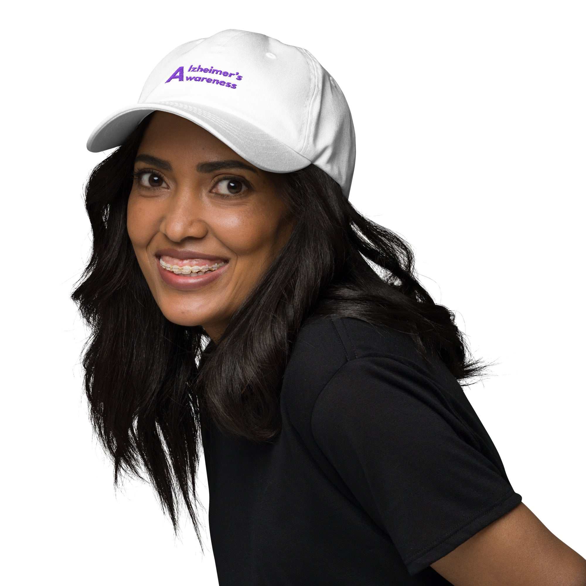 Person wearing a white Alzheimer’s awareness dad hat with purple embroidery