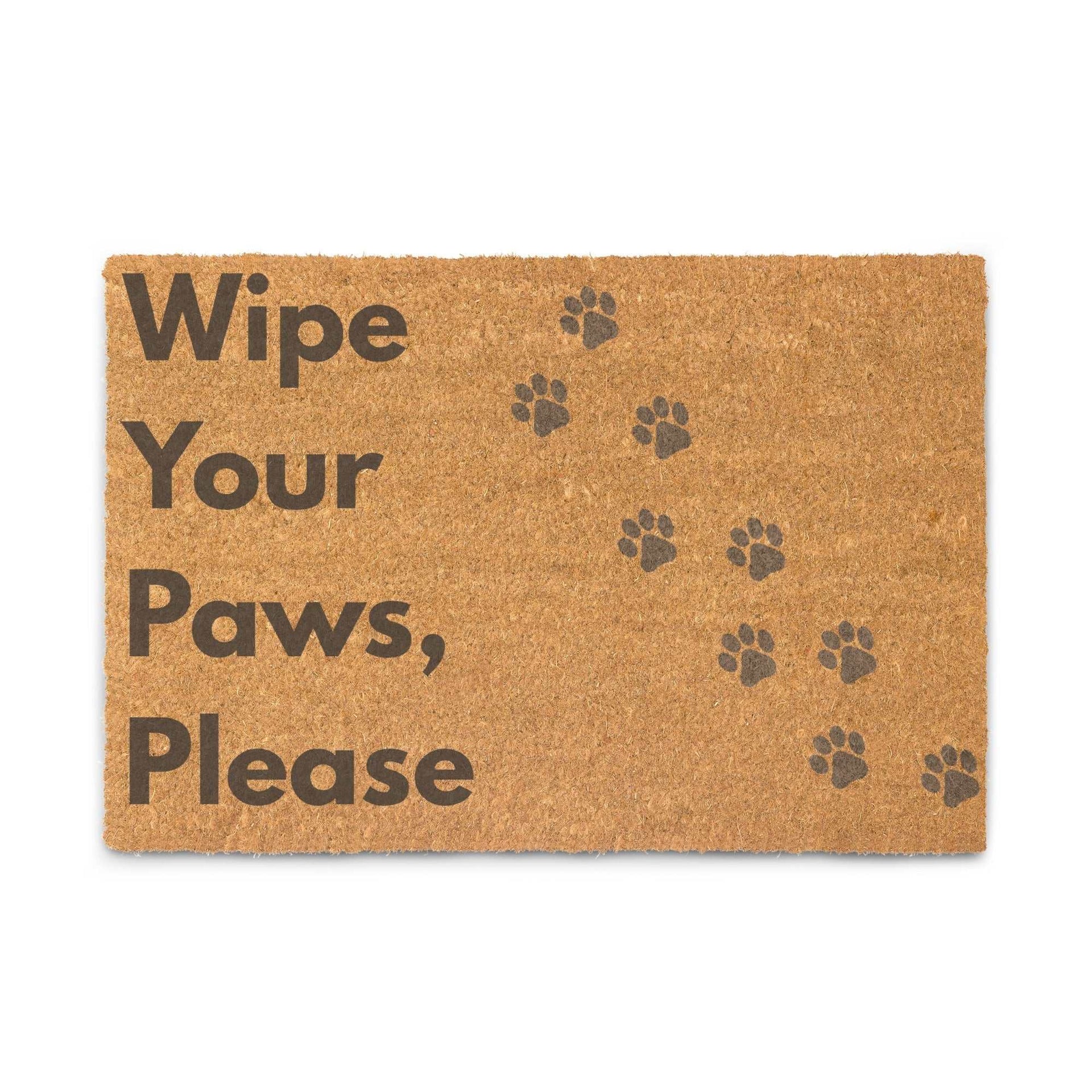 Coir doormat with "Wipe Your Paws Please" dog paw design, durable coconut fiber, black vinyl backing, ideal for covered outdoor use