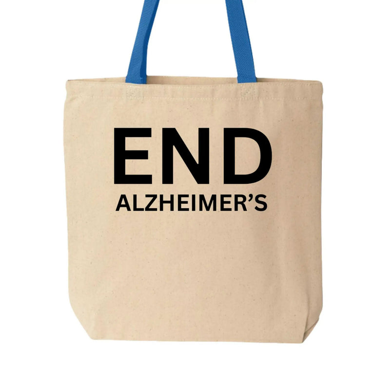 Cotton canvas tote bag with Alzheimer's Awareness design in natural and royal colors, from Greg's AZ Store.