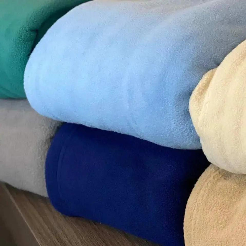 Soft GPF Collection fleece blanket by Rifz Textiles Inc, offering cozy warmth and comfort, shown folded on a neutral surface.