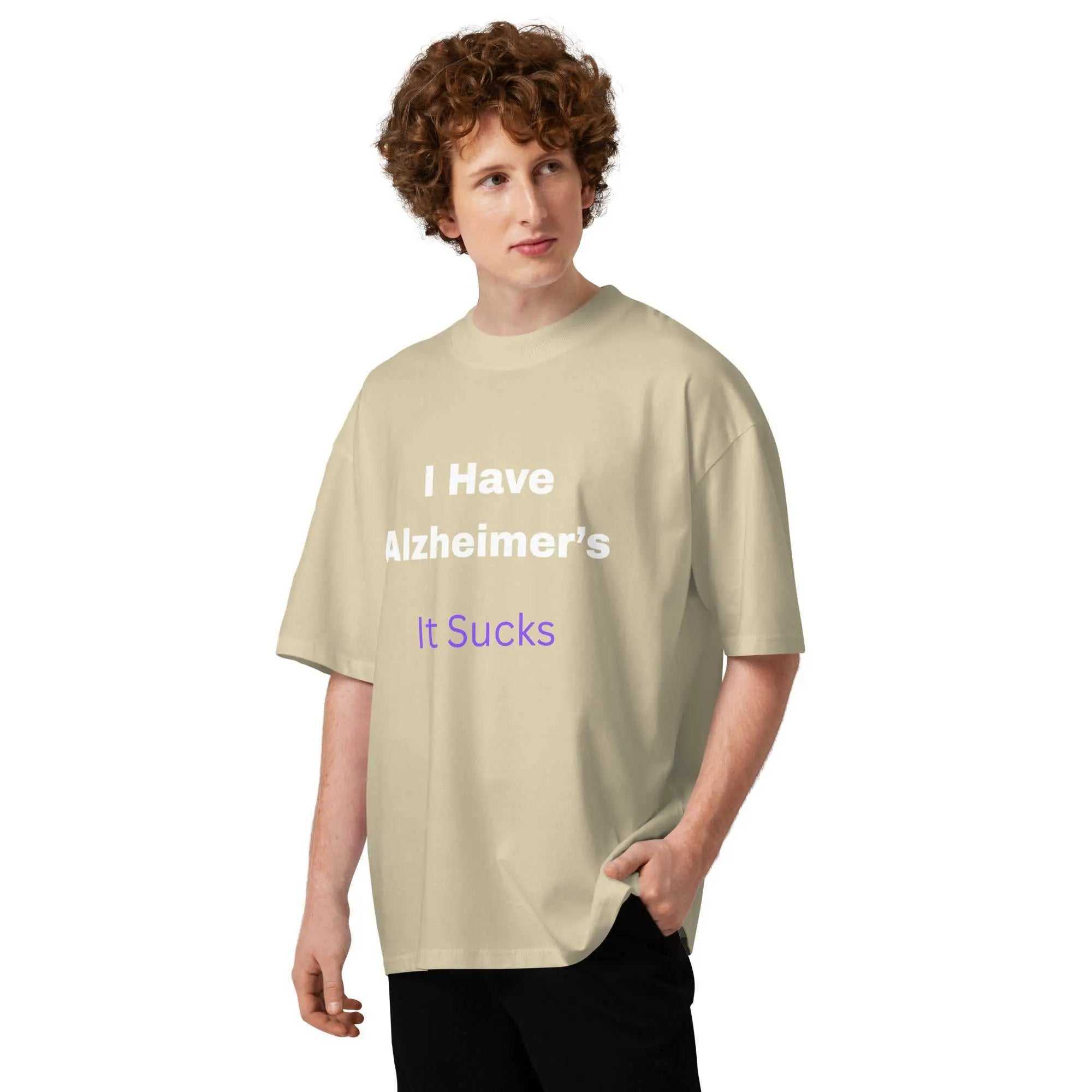 Person wearing beige oversized high neck t-shirt with I Have Alzheimers It Sucks text