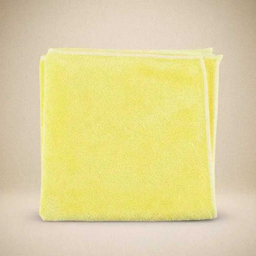 Folded yellow microfiber cleaning cloth for caregiver use