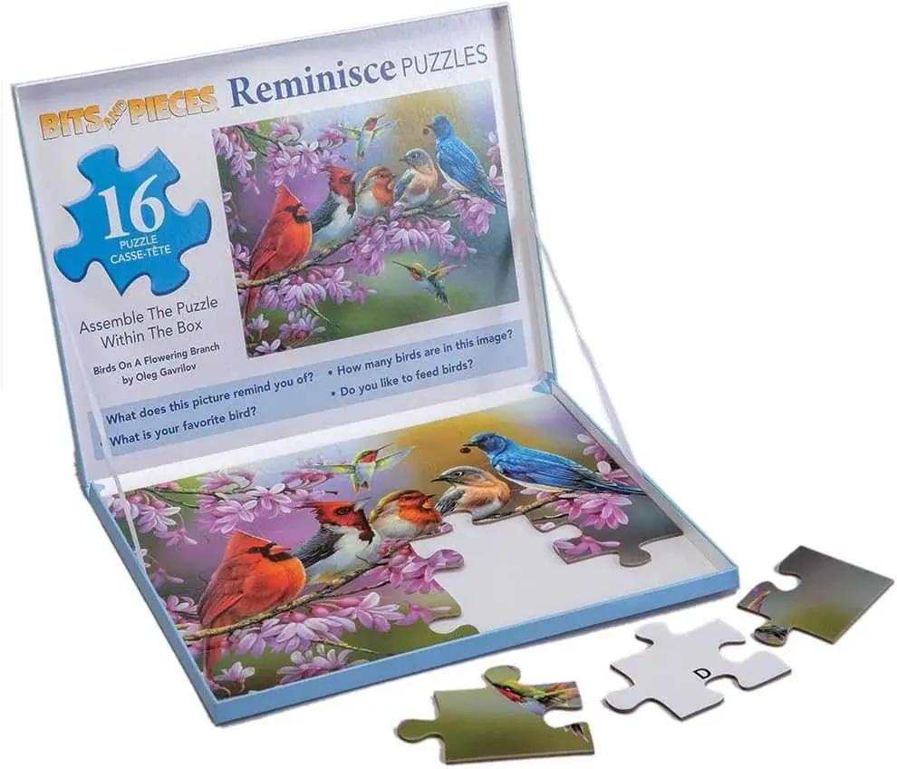 Large piece puzzle featuring birds on a flowering branch with sixteen pieces in a box