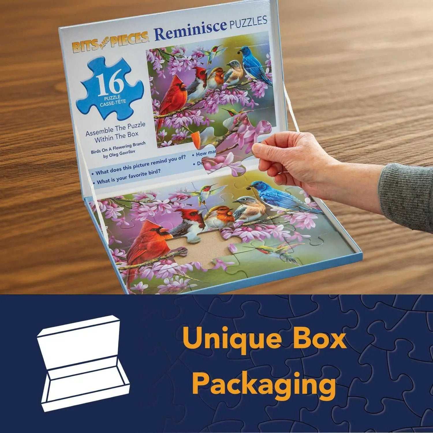 Large piece puzzle with birds on flowering branch theme in open box packaging
