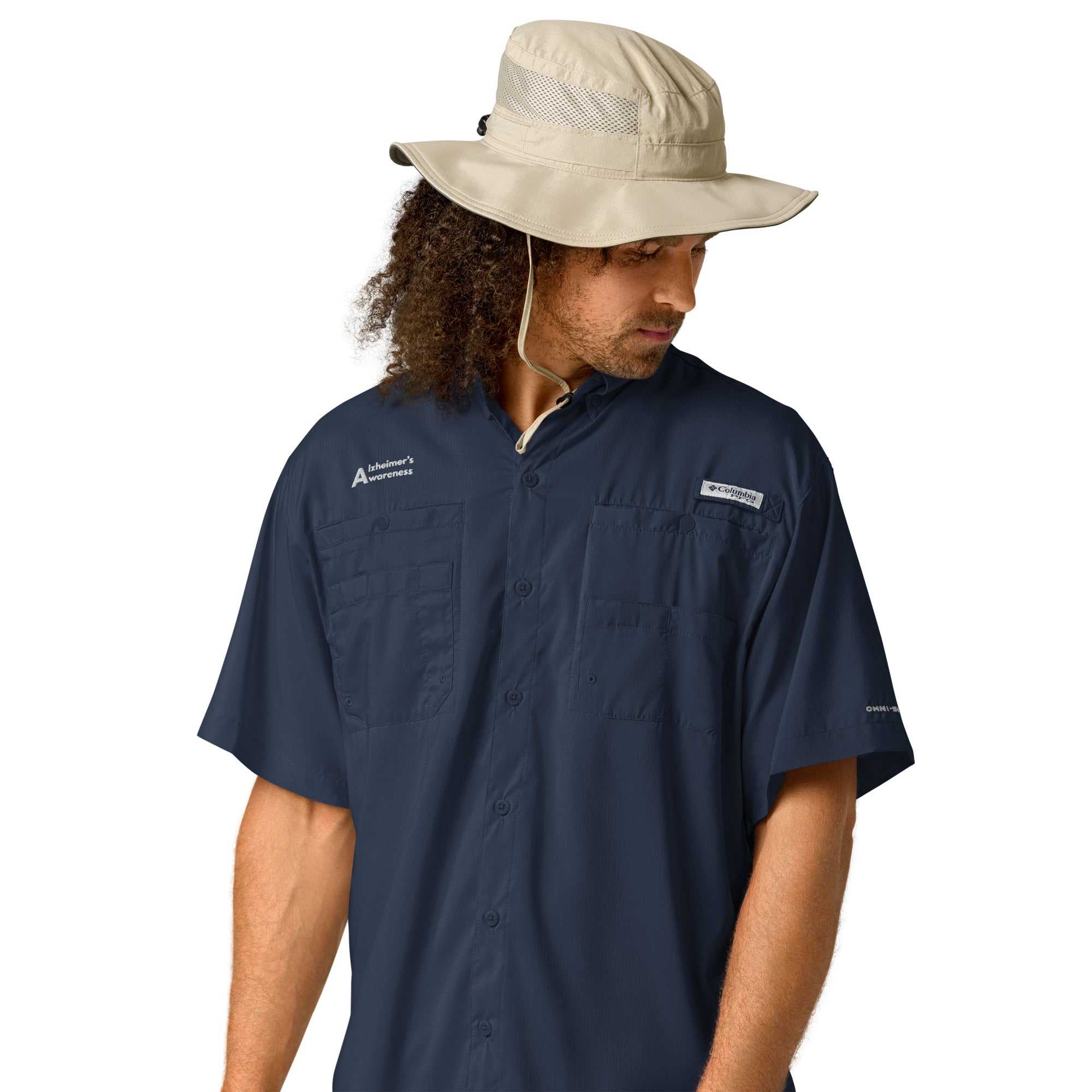 Man wearing a navy blue Columbia Alzheimer’s Awareness short sleeve shirt and a beige bucket hat