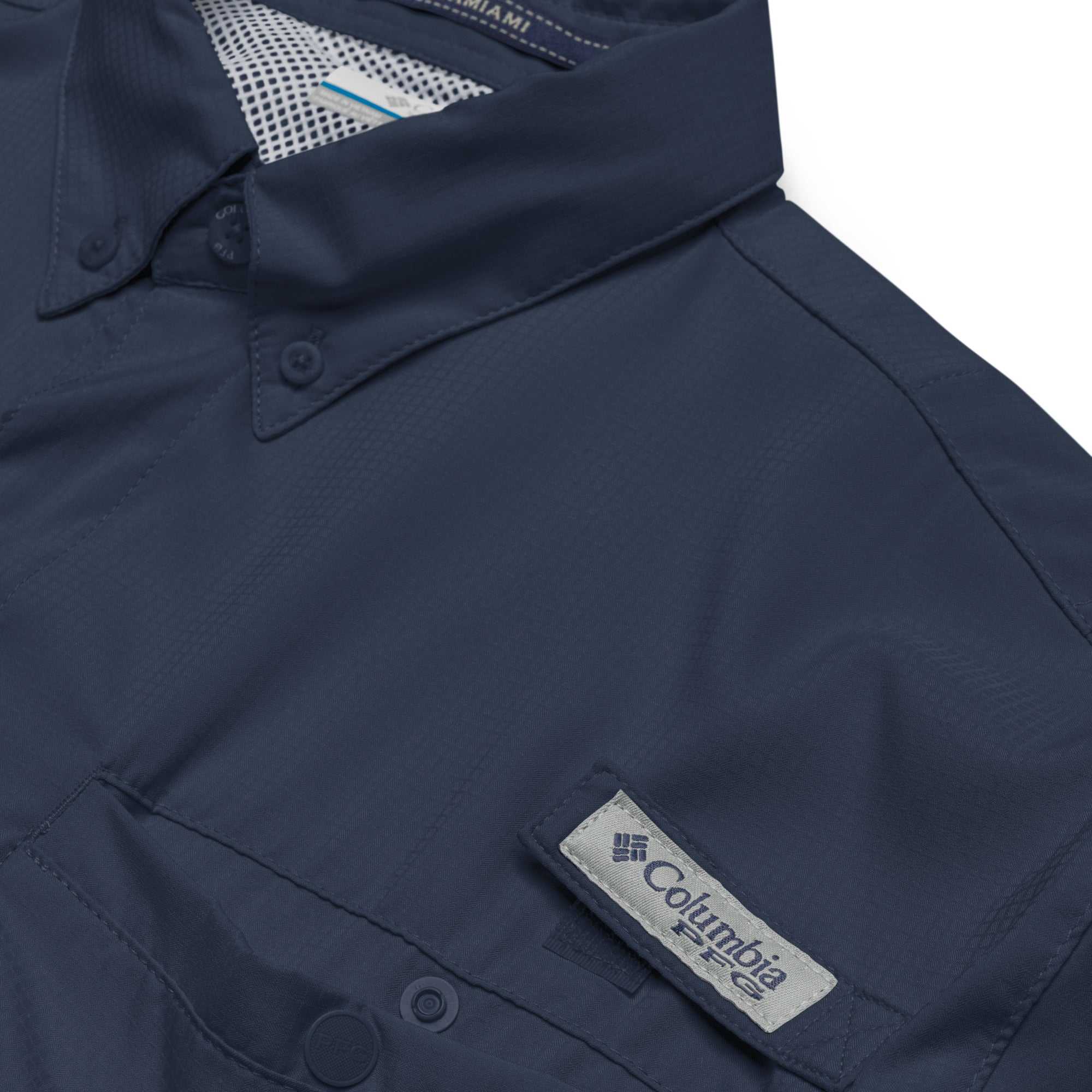 Close up of navy blue Columbia Alzheimer’s Awareness short sleeve shirt with PFG logo patch