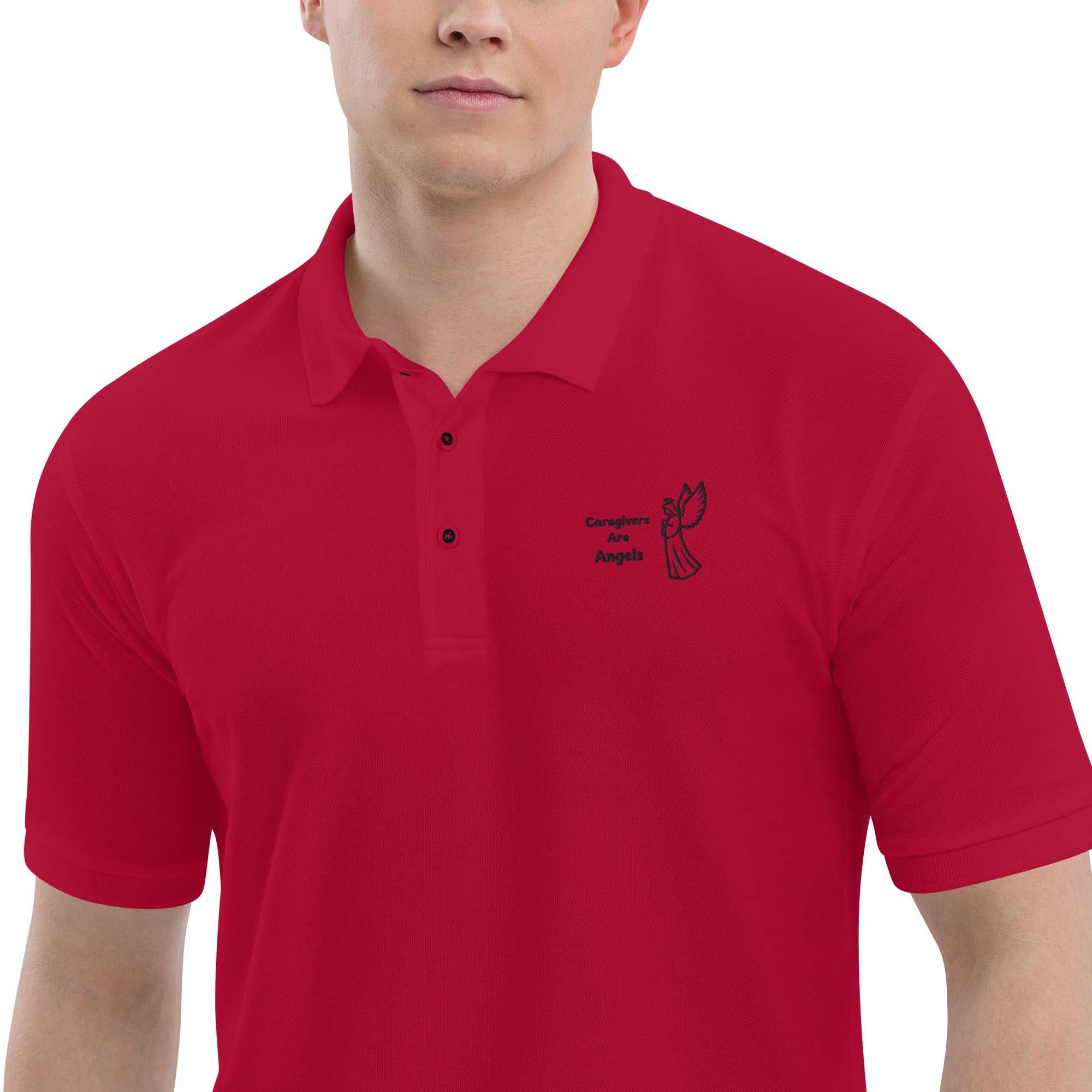Man wearing red premium caregiver polo with black angel graphic and text Caregivers Are Angels