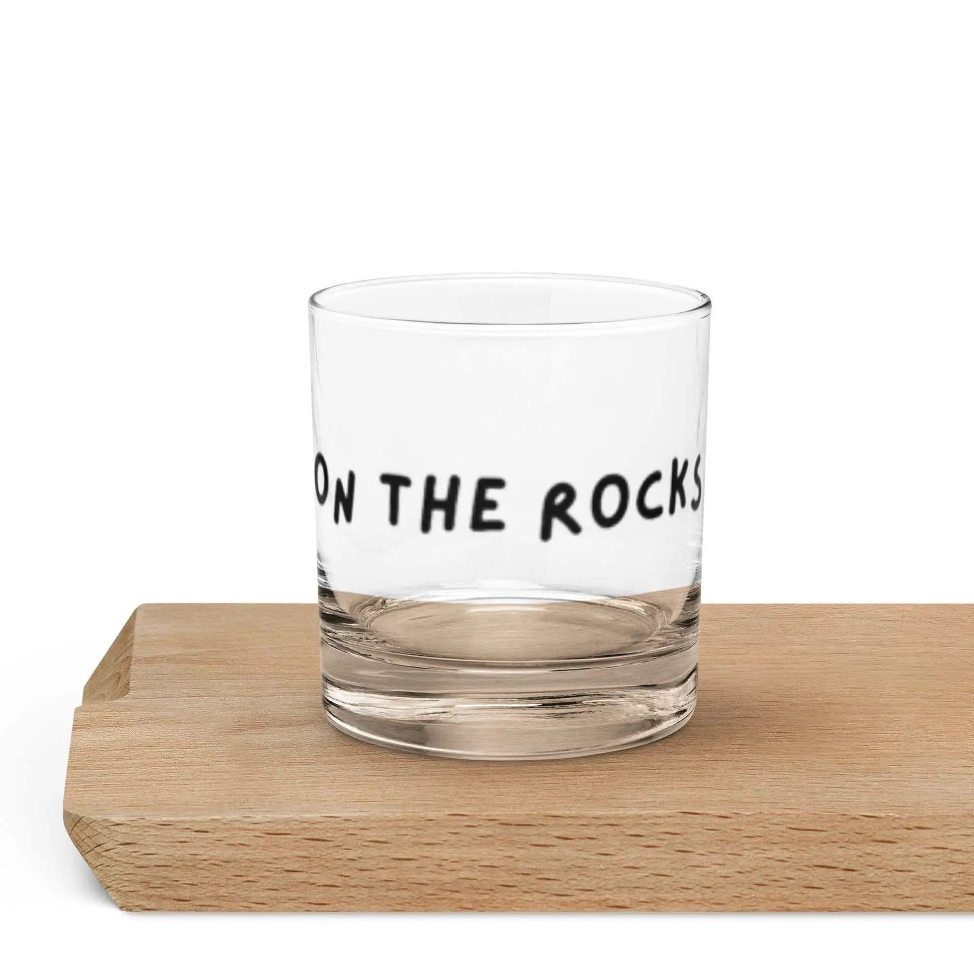 Clear glass on the rocks glass for cocktails, classic style, with a sturdy base, perfect for serving spirits or mixed drinks.
