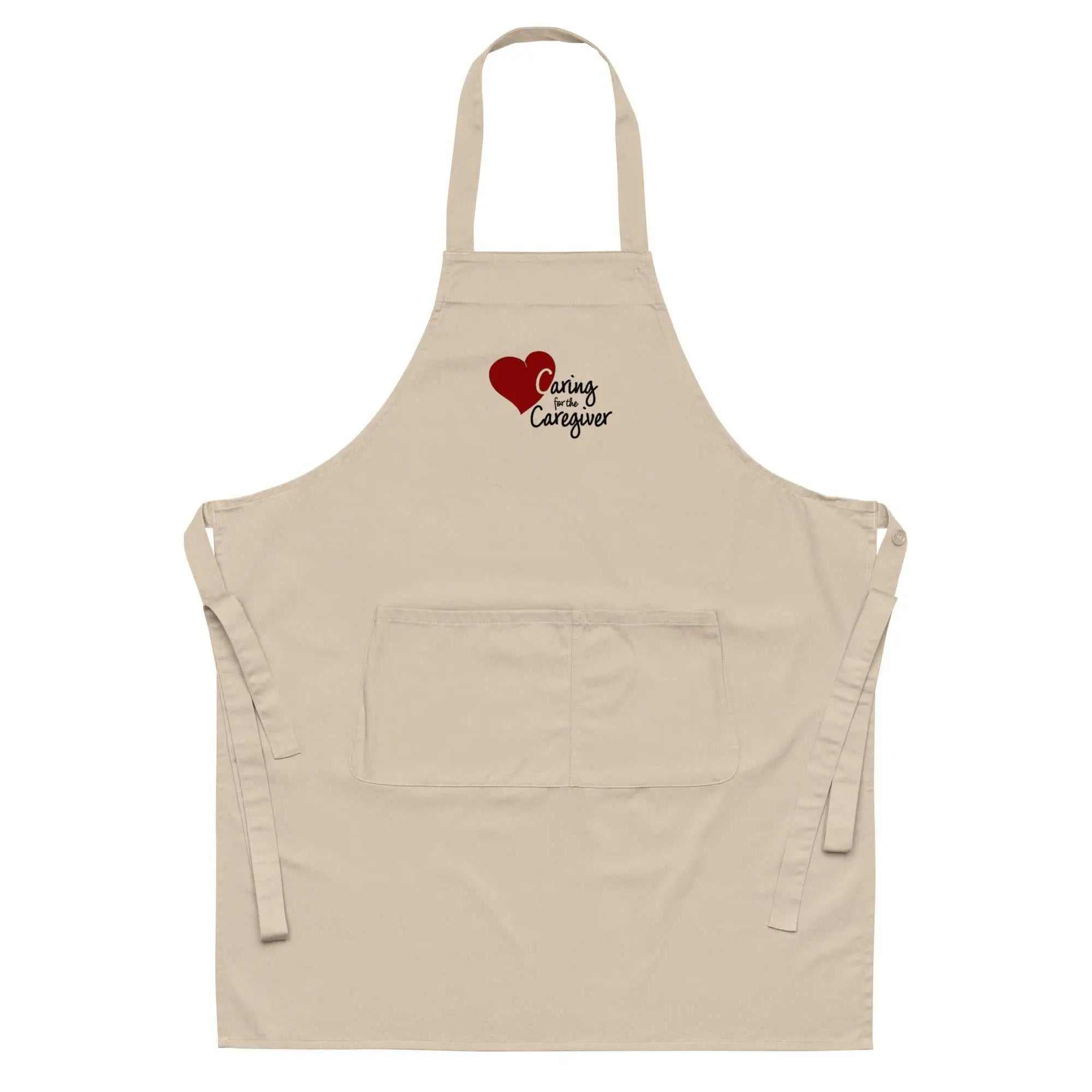 Beige Caregiver Apron with a red heart and Caring for the Caregiver text on the chest