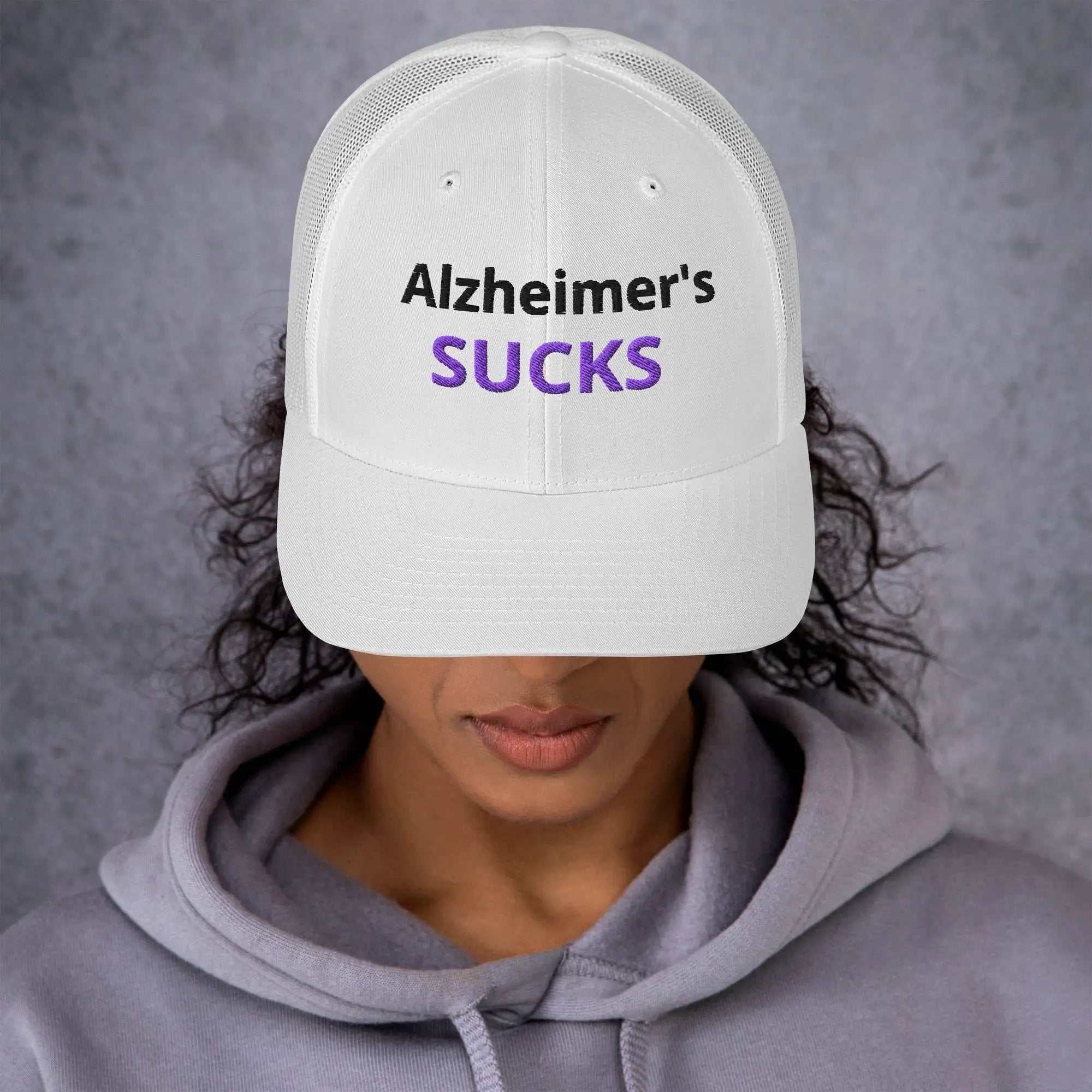 White Alzheimer's Embroidered Trucker Cap with black and purple text
