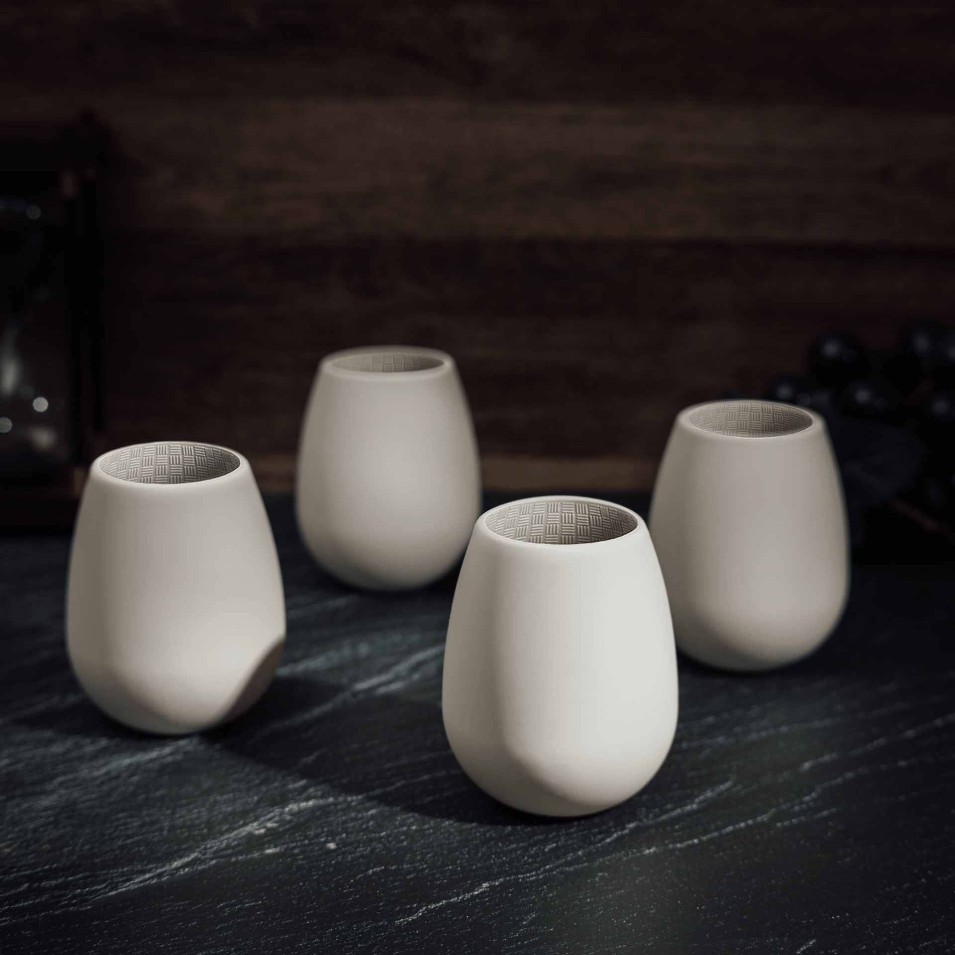 Set of 4 white silicone stemless wine glasses, shatterproof and reusable, perfect for outdoor parties and camping.