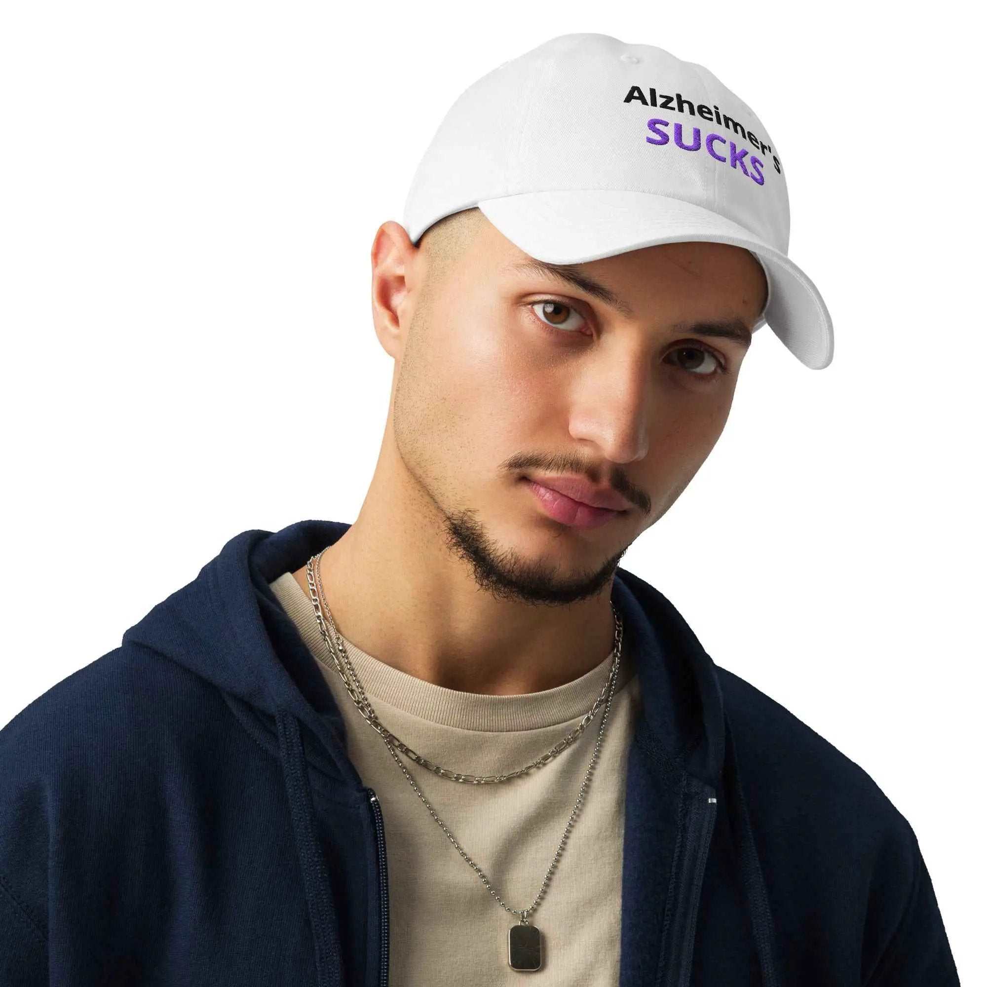 White Under Armour dad hat with embroidered Alzheimer's SUCKS text worn by a man