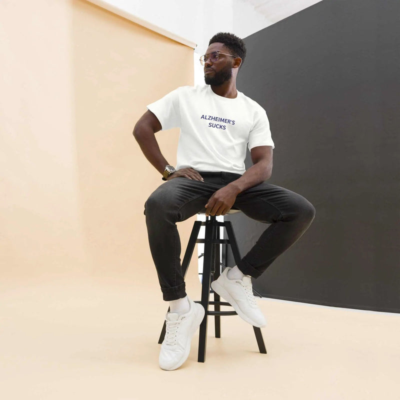 Unisex white Alzheimer's Sucks T-shirt by Greg's AZ Store featuring bold black text on the front.