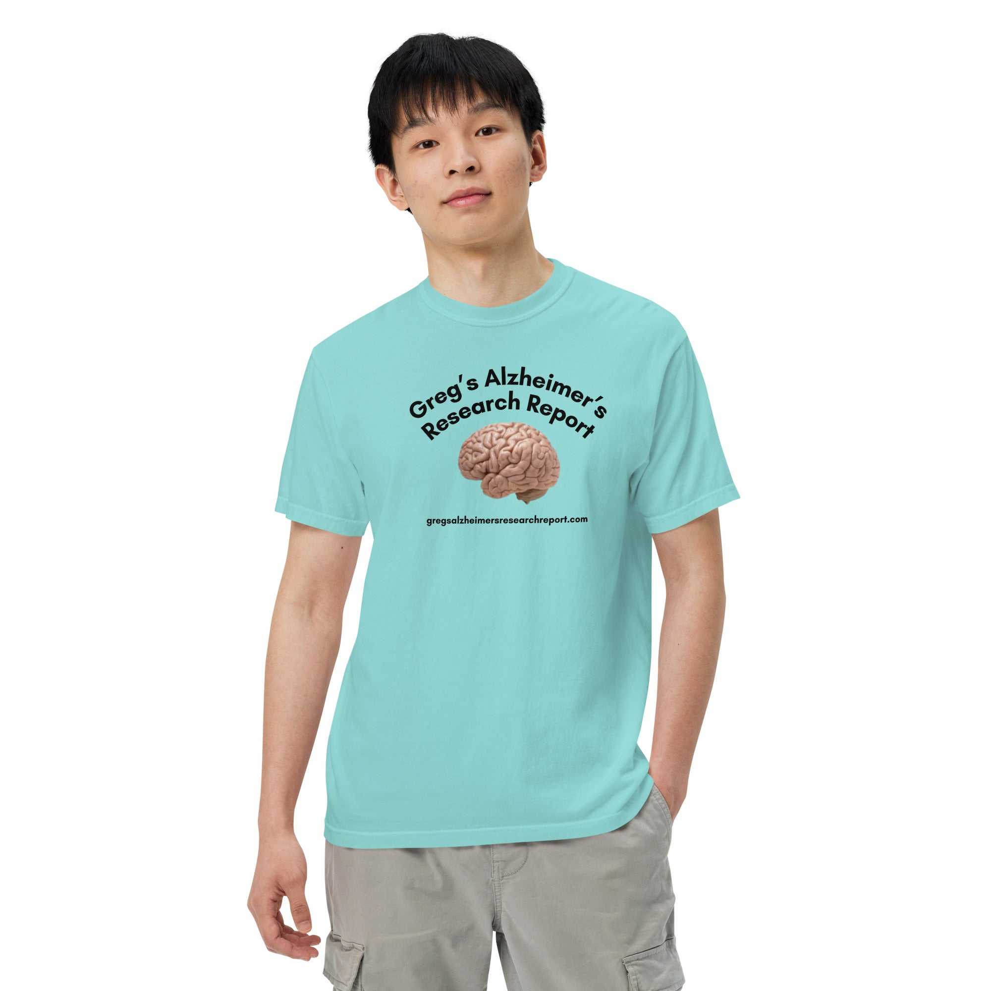 Man wearing a light blue heavyweight t-shirt with a brain graphic and Gregs Alzheimers Research Report text