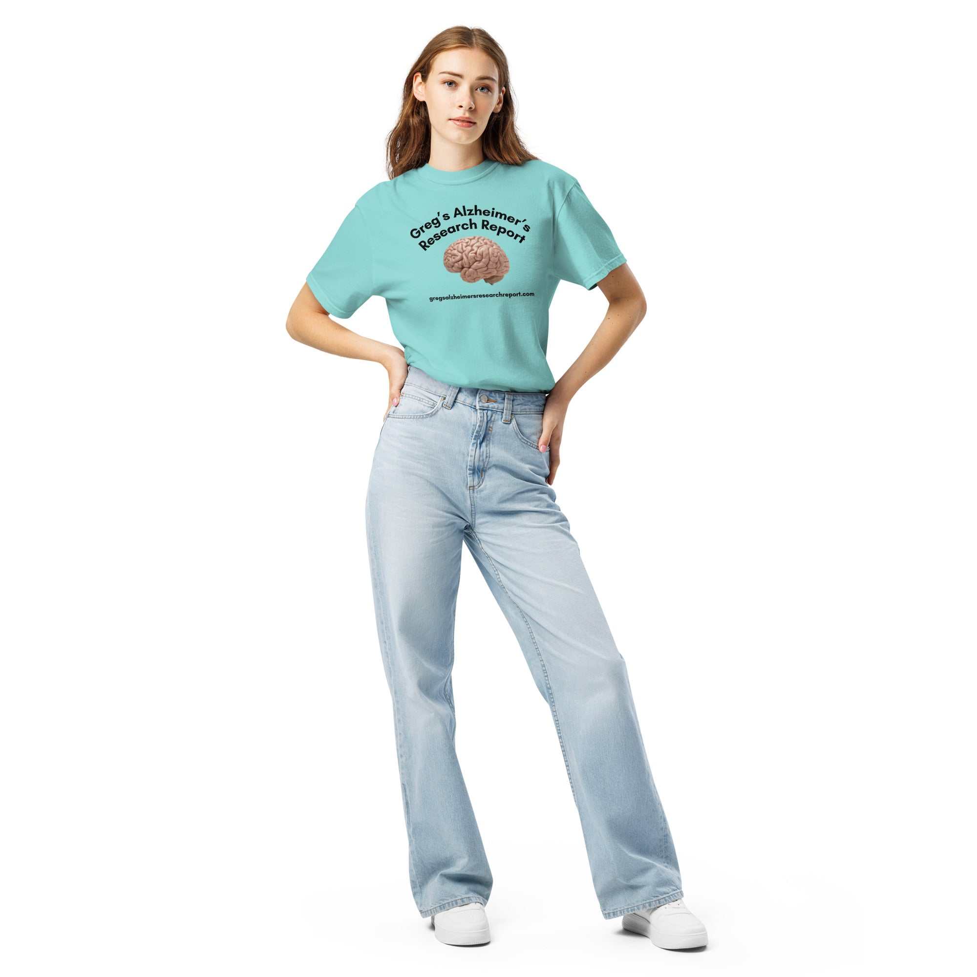 Woman wearing a light blue heavyweight t-shirt with Gregs Alzheimers Research Report logo and a brain graphic