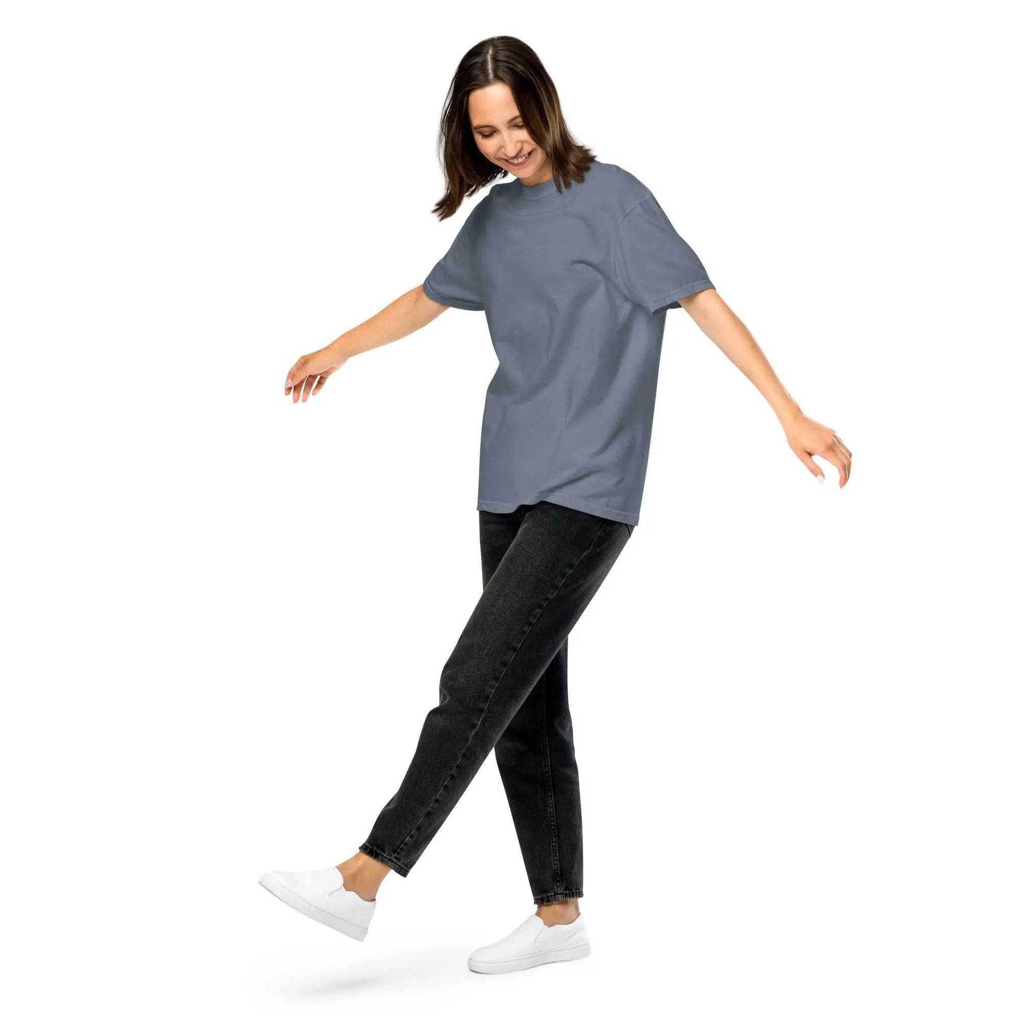 Person wearing a blue Alzheimer's T-shirt Unisex Garment-Dyed Heavyweight with black jeans and white sneakers