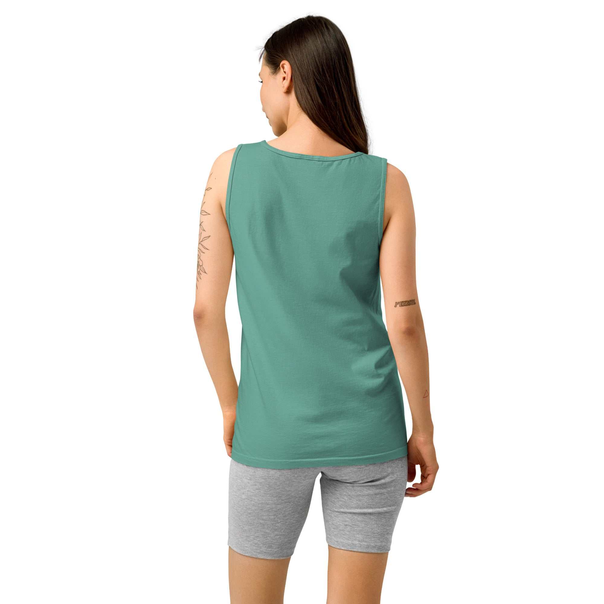 Back view of a woman wearing a green Empowered Comfort Caregiver Vintage Tank Top with grey shorts