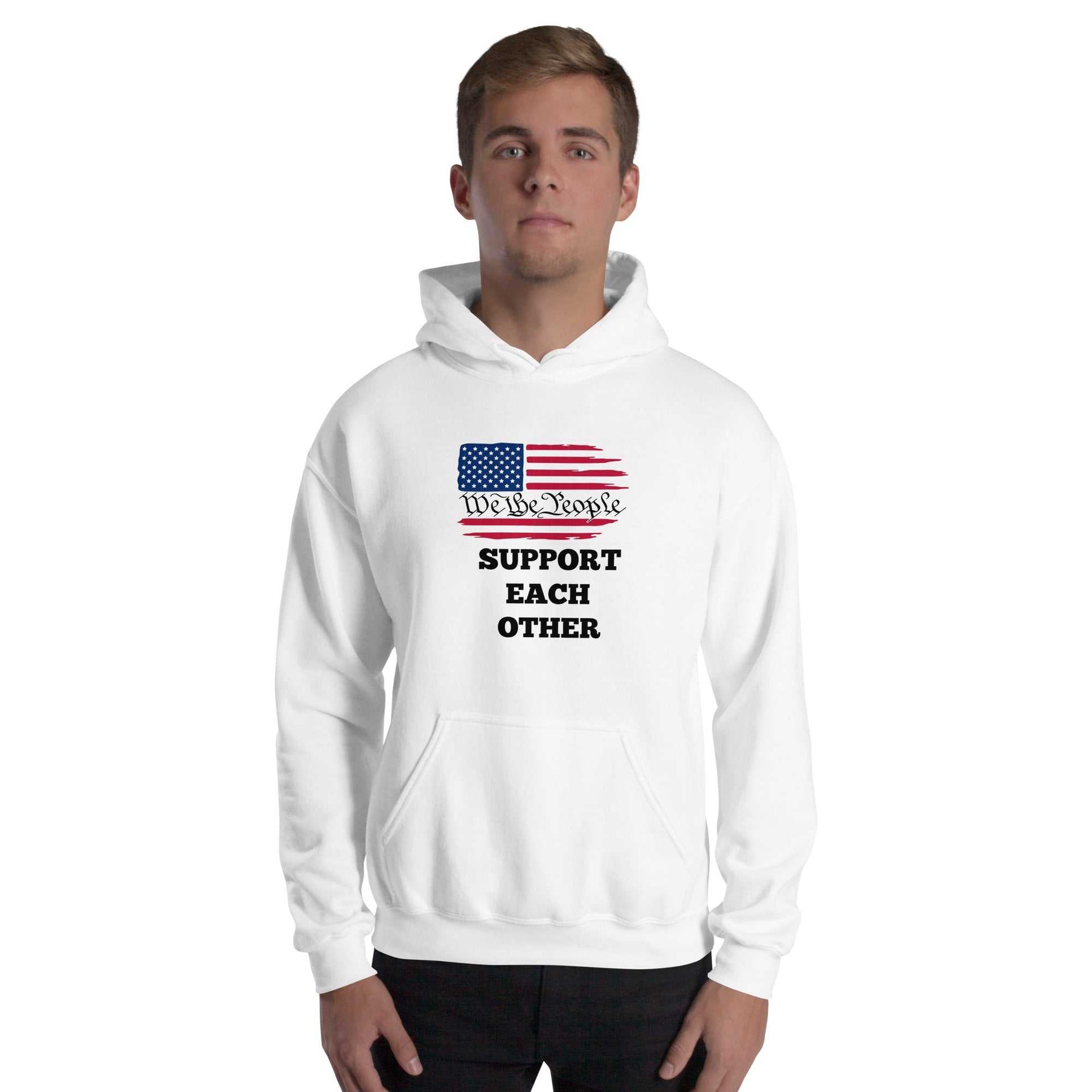 Unisex hoodie front view with We The People Support Each Other text, cozy soft fabric, double-lined hood, and front pouch pocket