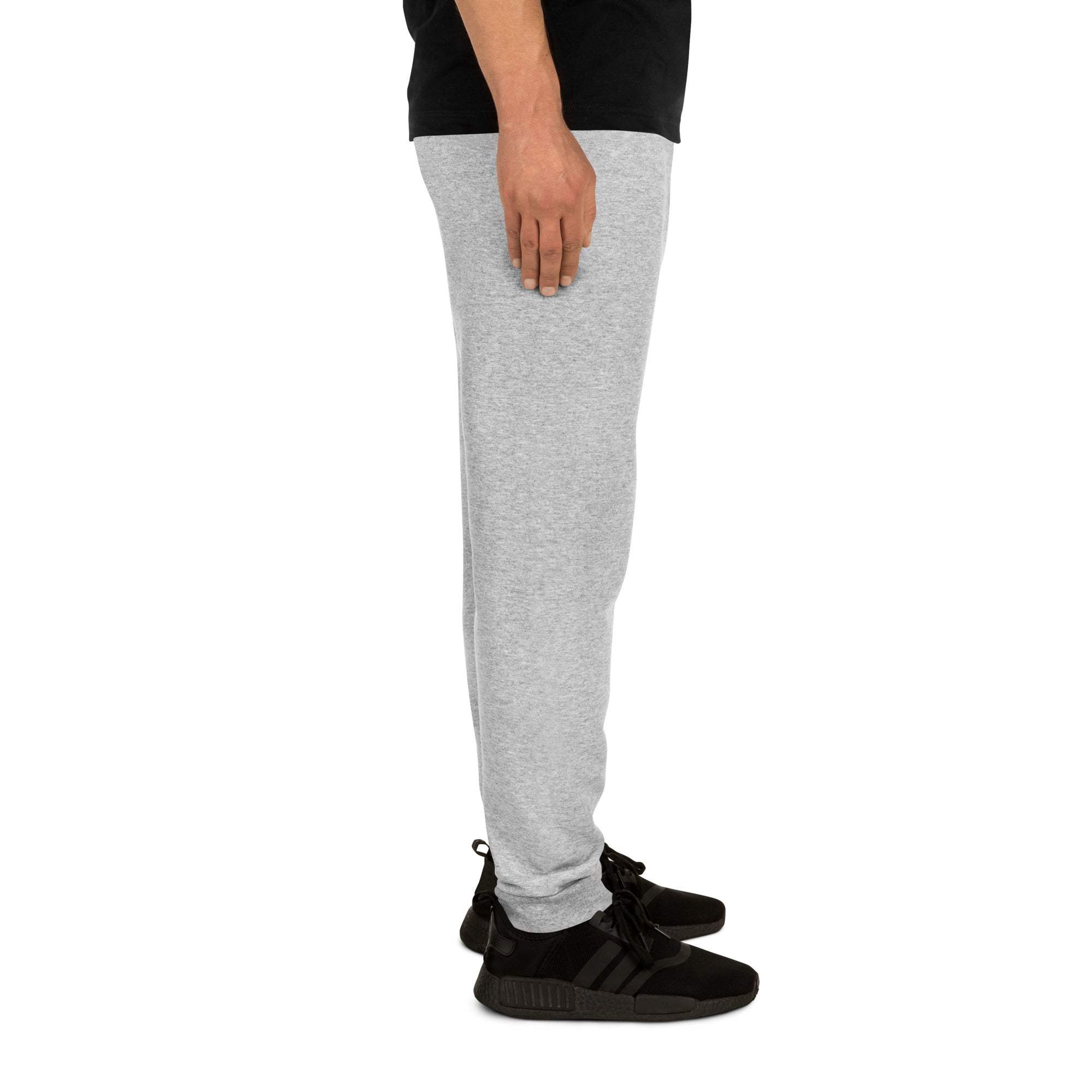 Side view of grey unisex joggers for Alzheimer's prevention worn with black sneakers