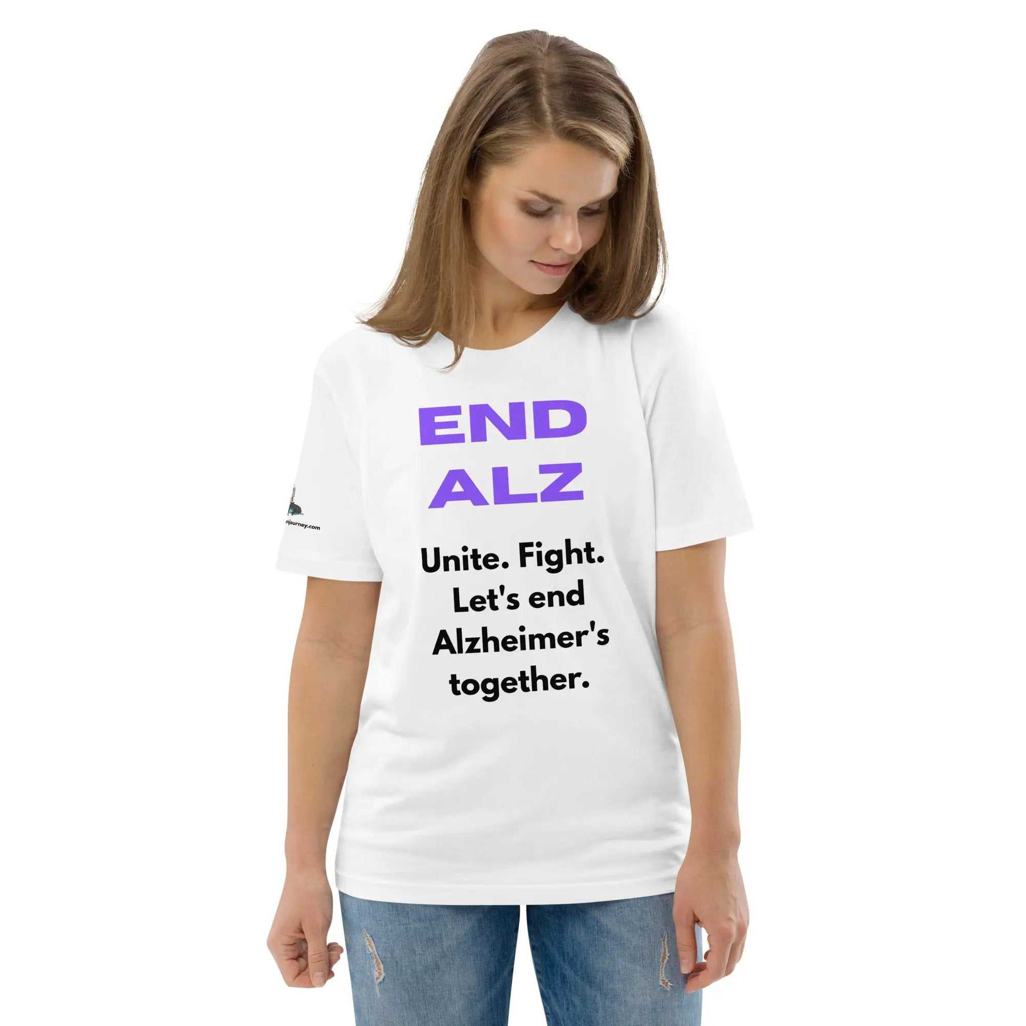 Woman wearing white END ALZ unisex t-shirt with purple and black text