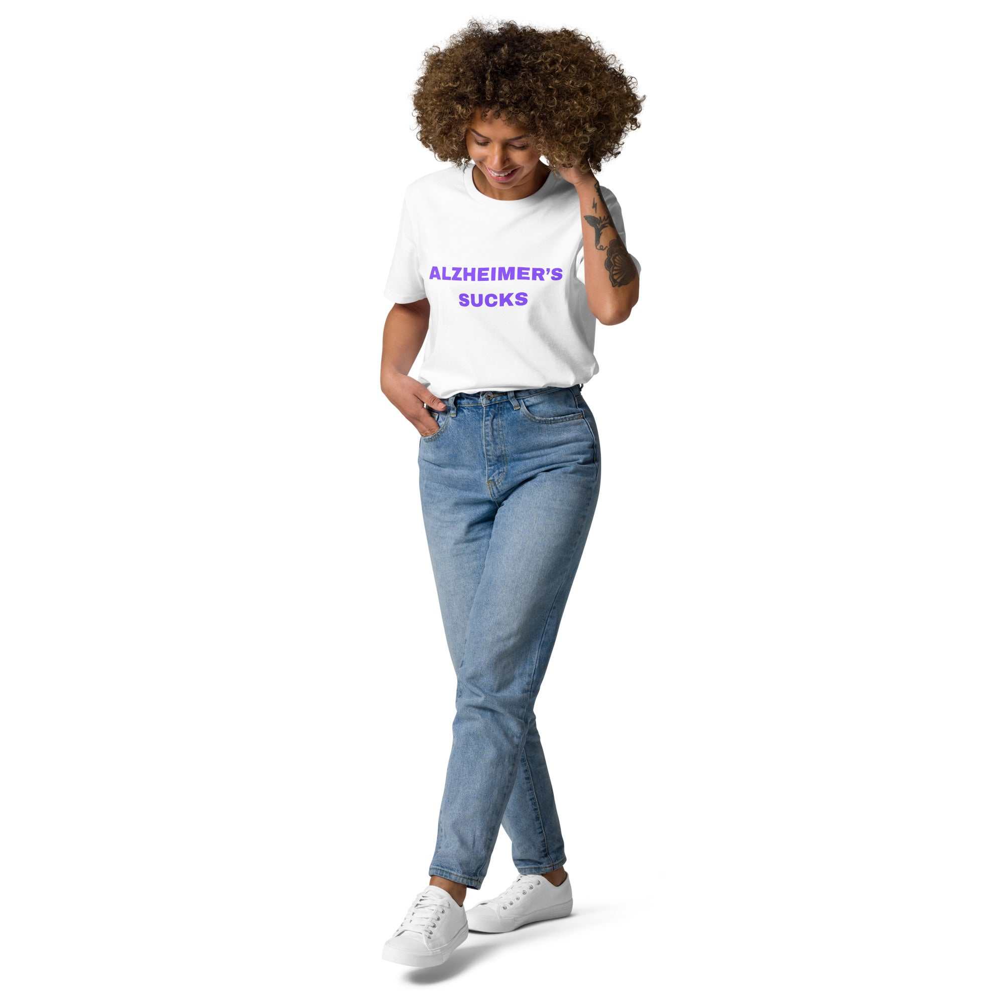 Person wearing white Alzheimers Sucks unisex organic cotton t-shirt with blue jeans