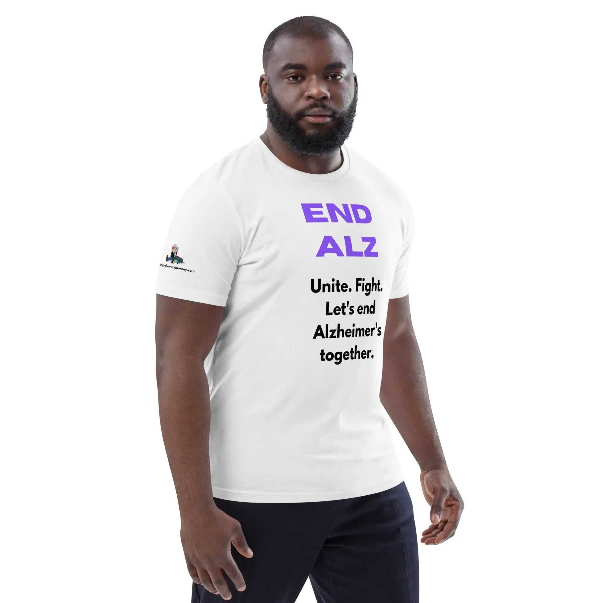 Man wearing white END ALZ unisex t-shirt with purple and black text