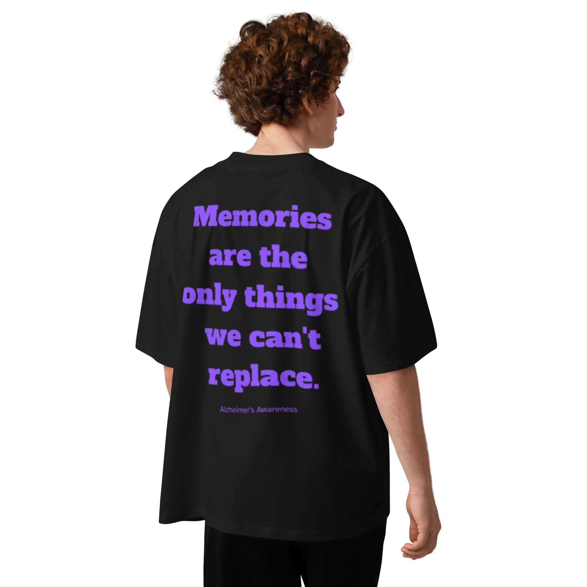 Back view of black unisex organic oversized t-shirt with purple Alzheimer's awareness text graphic