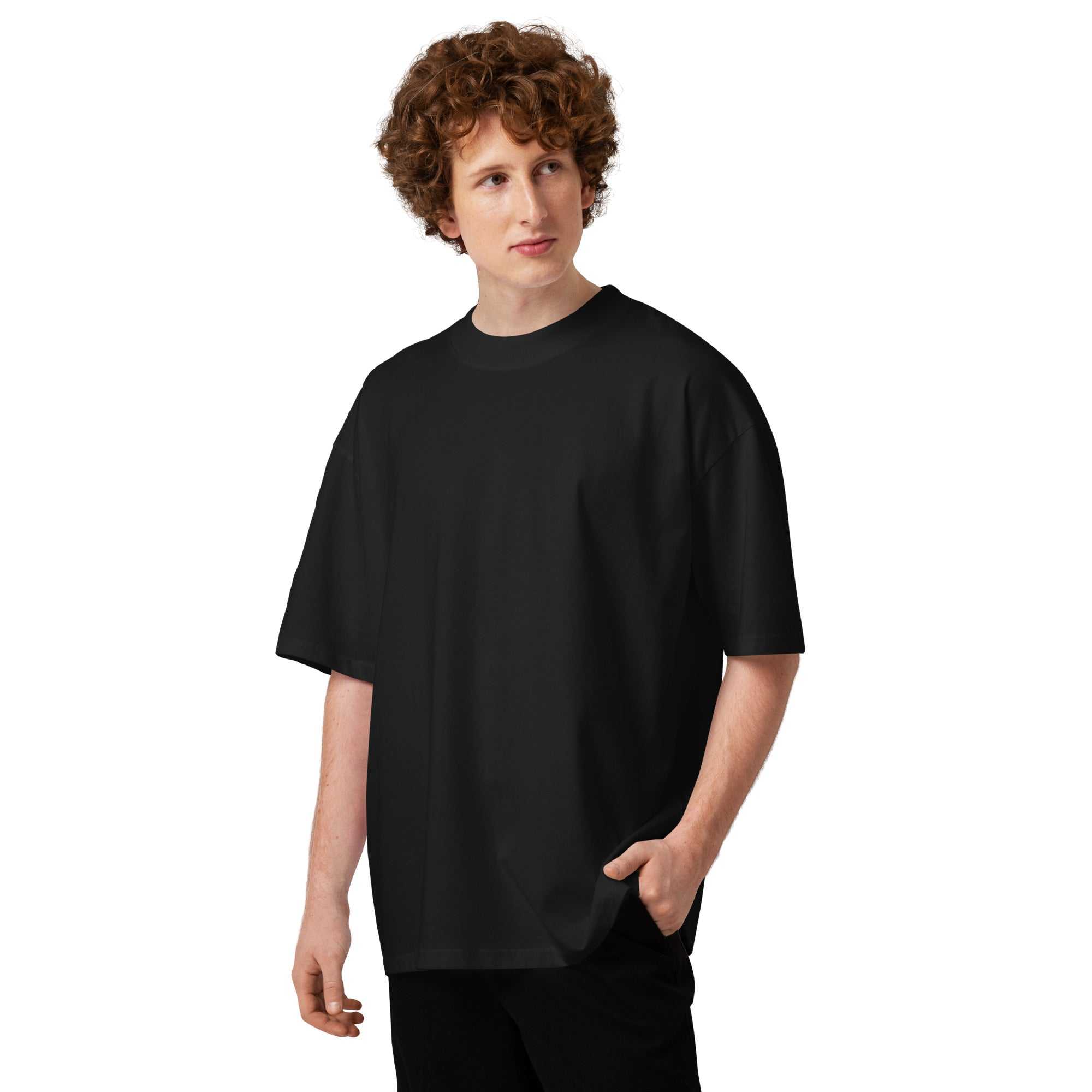 Person wearing a black unisex organic oversized t-shirt