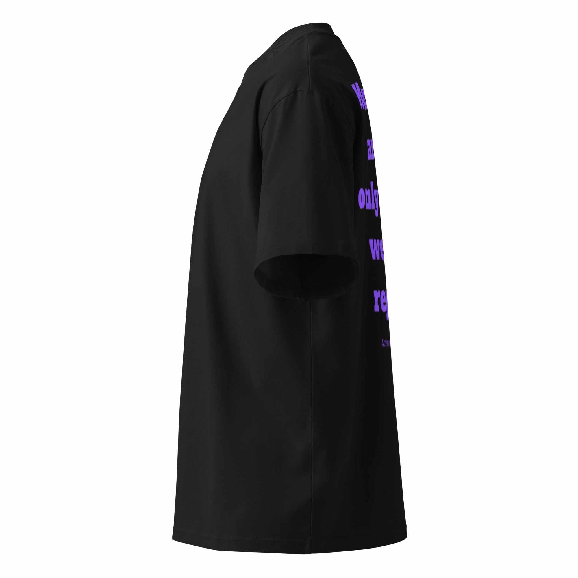 Side view of black unisex organic oversized t-shirt with purple Alzheimer awareness graphic text