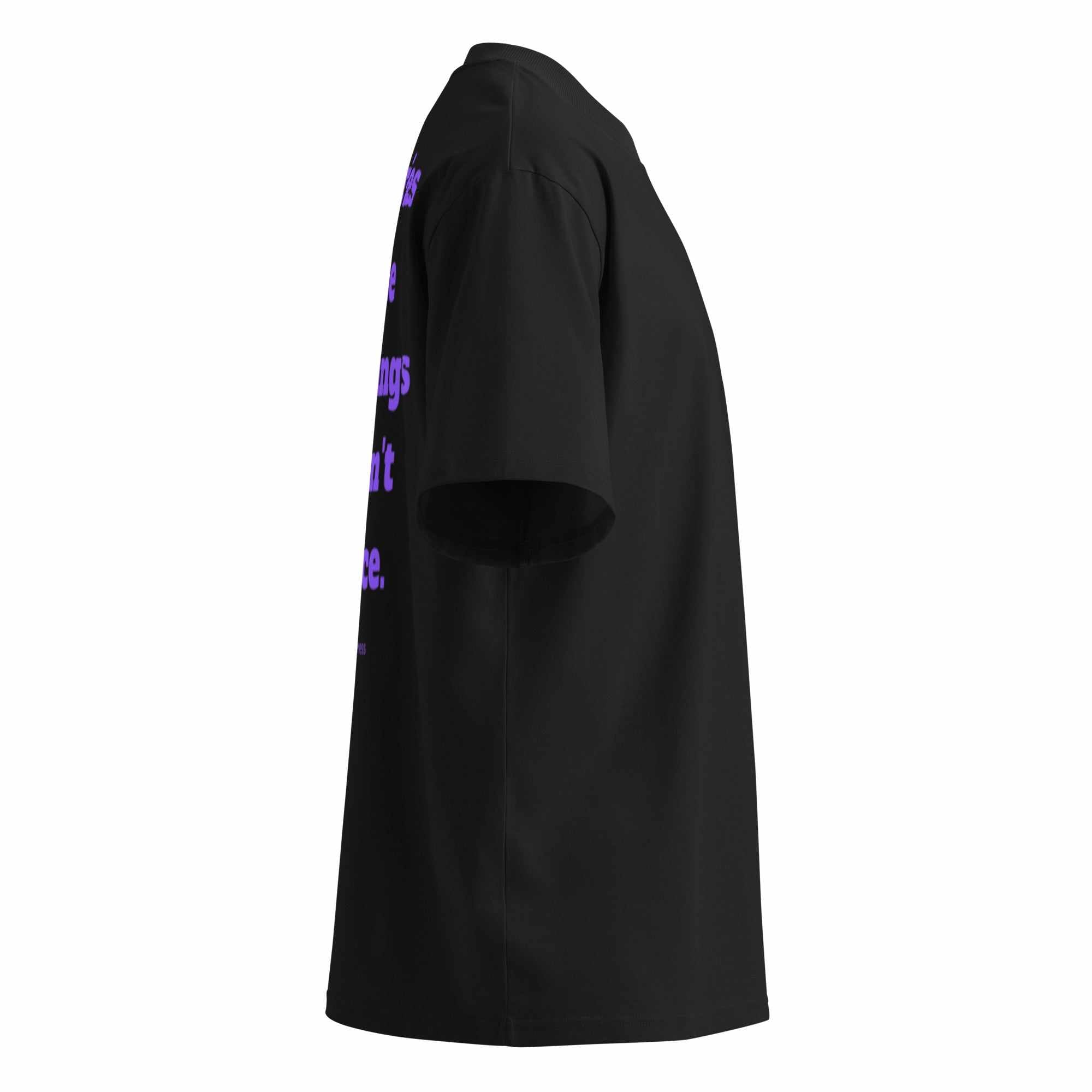 Side view of black unisex organic oversized t-shirt with purple Alzheimer awareness graphic text