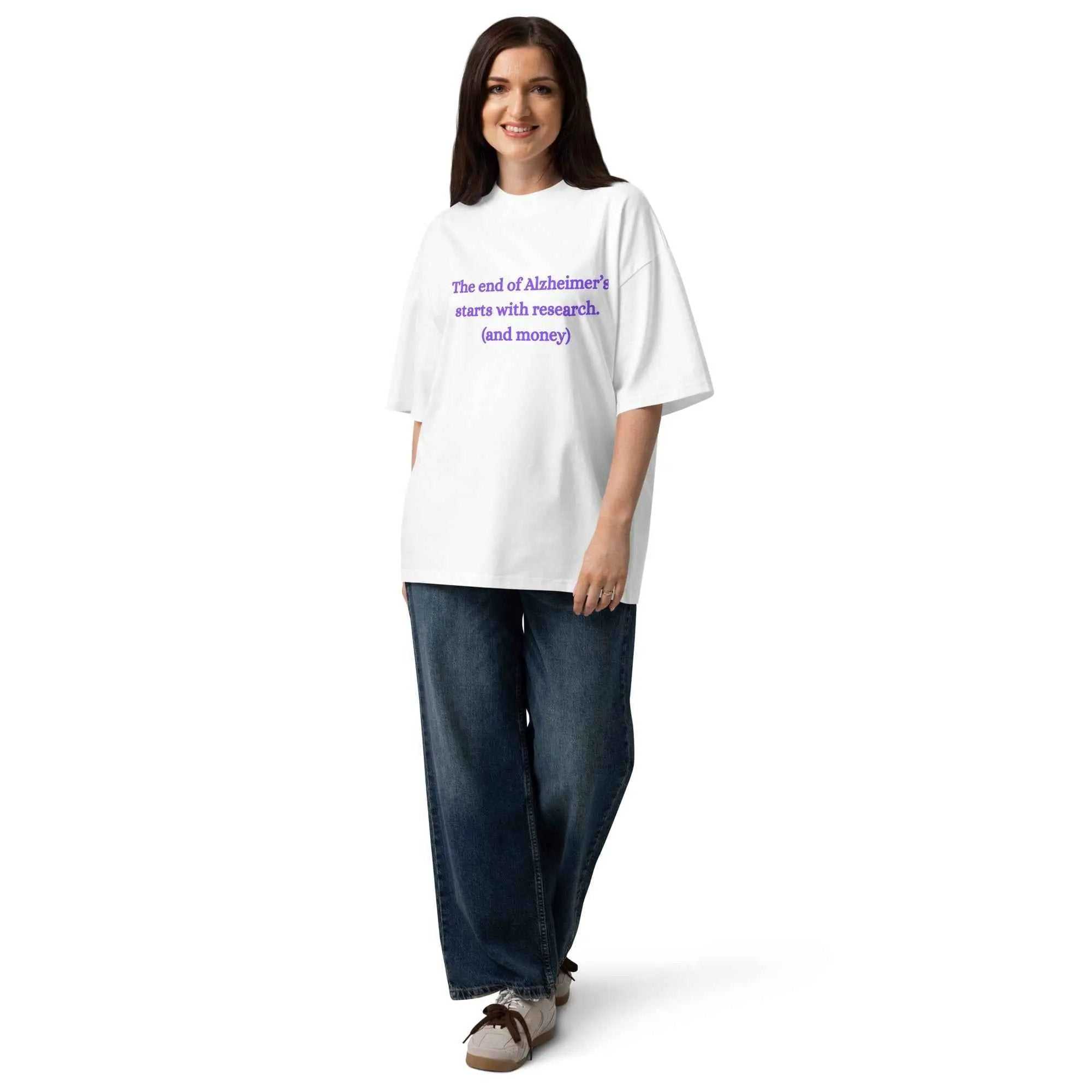 Person wearing white Alzheimer's Awareness T-Shirt with purple text The end of Alzheimer's starts with research and money