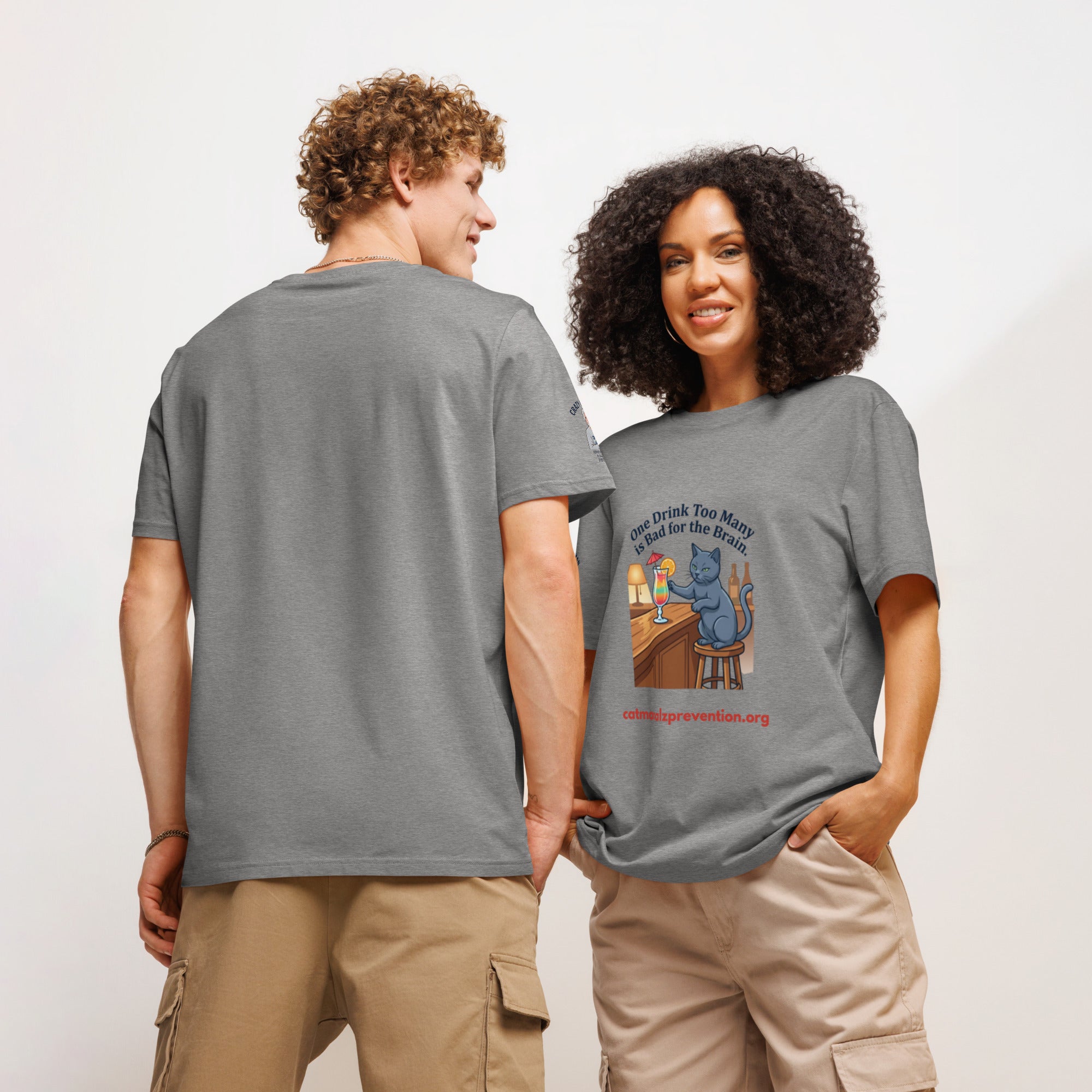 Man and woman wearing grey Unisex Organic Ribbed Neck T-Shirt with cat graphic and Alzheimer prevention text