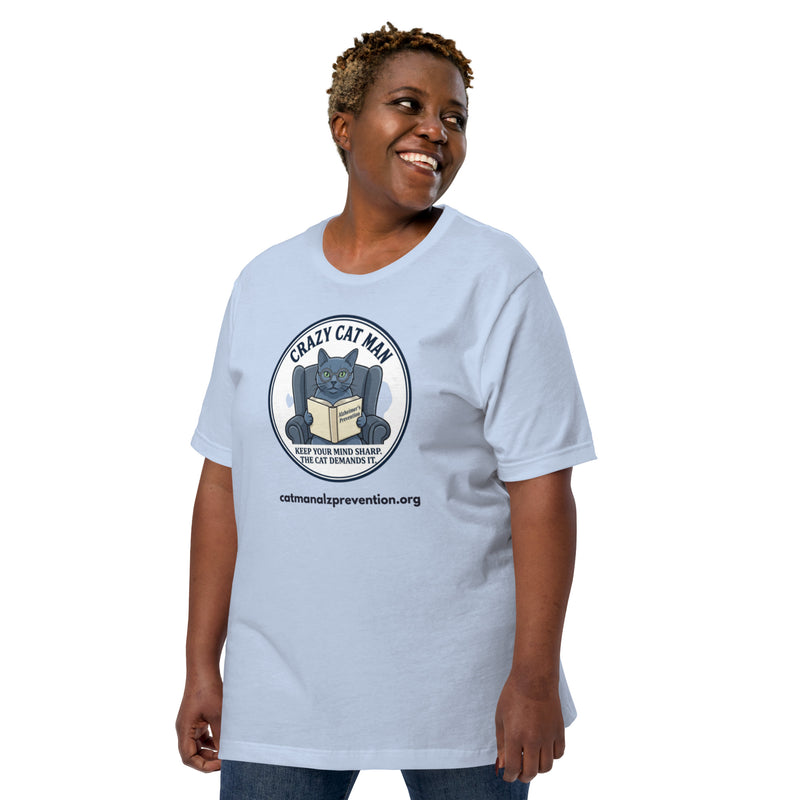 Person wearing a light blue t-shirt with a Crazy Cat Man Reading graphic