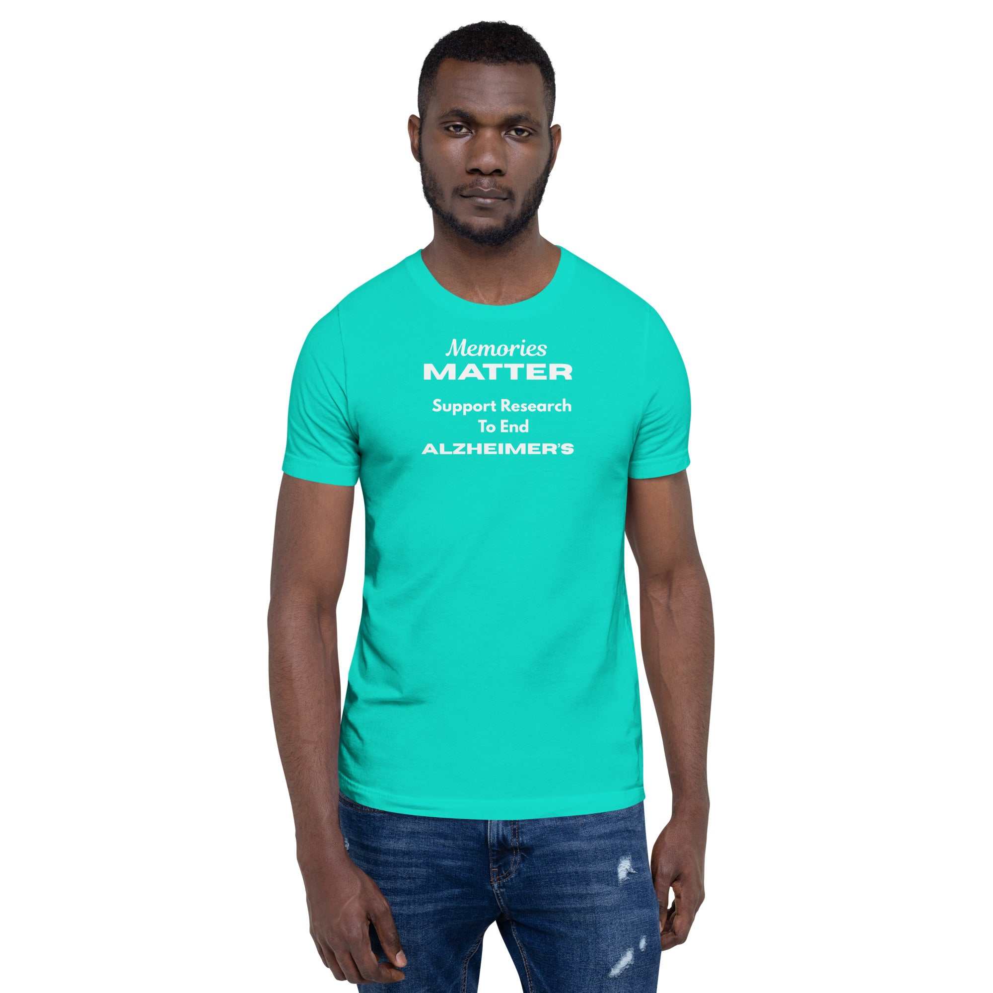 Man wearing a teal Memories Matter Alzheimer's Awareness T-shirt with white text