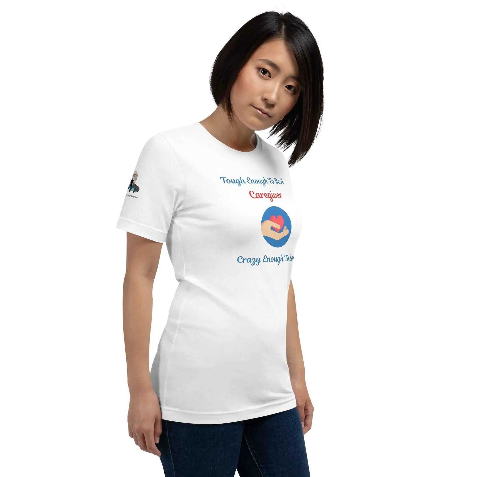 Woman wearing a white Caregiver Alzheimer's Awareness T-Shirt with heart and hand graphic