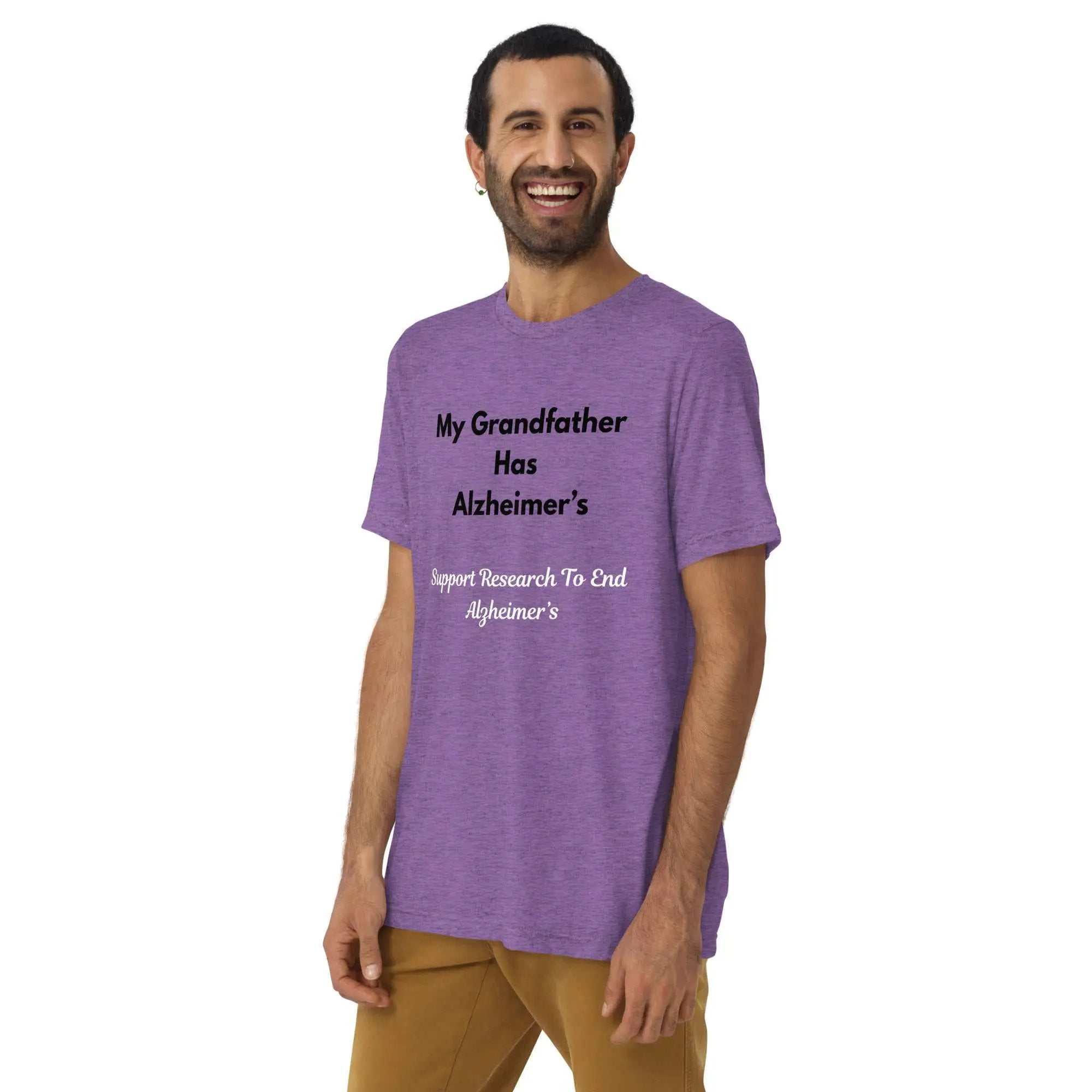 Man wearing a purple Alzheimer's awareness shirt with the text My Grandfather Has Alzheimer's