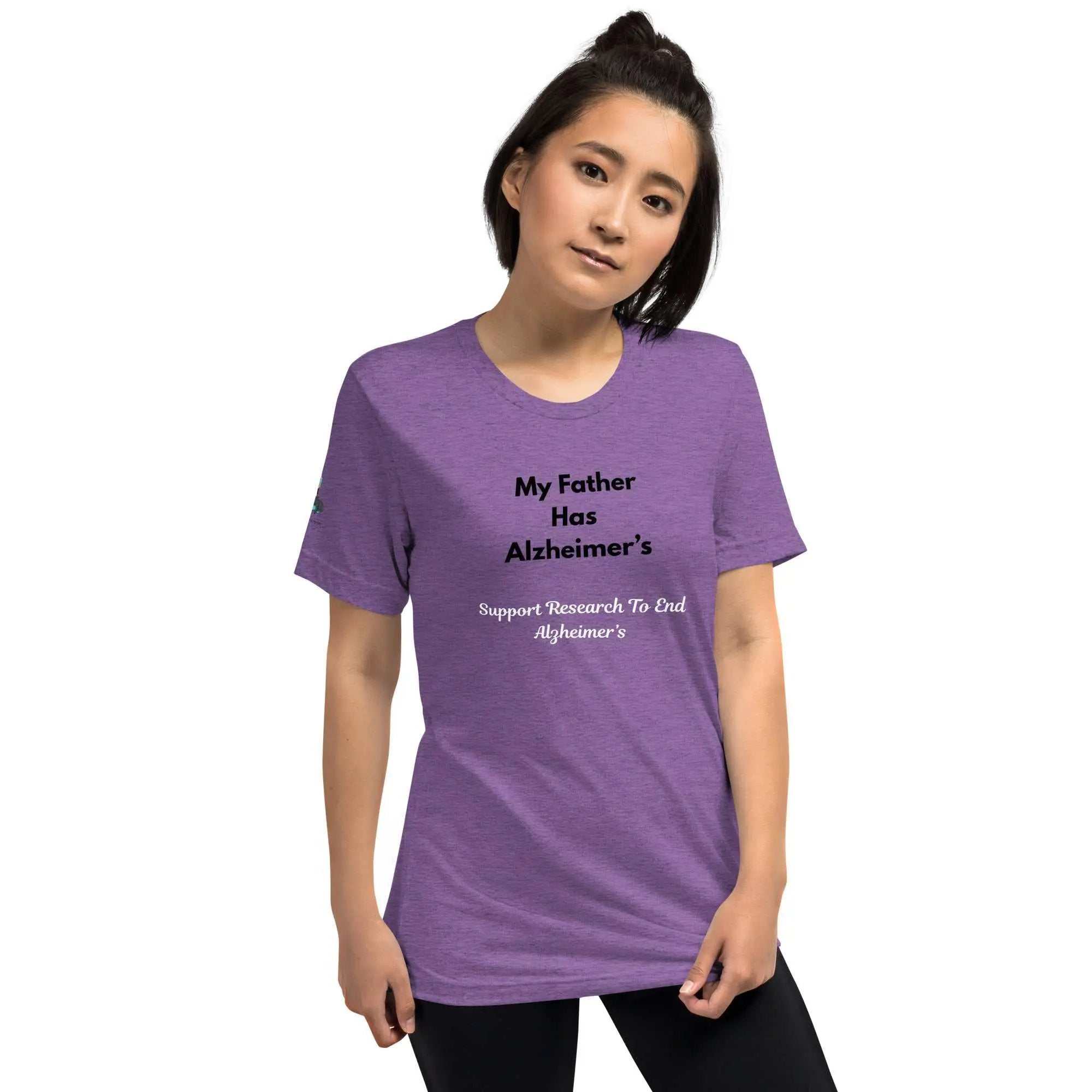 Woman wearing a purple Alzheimer's awareness shirt with the text My Father Has Alzheimer's