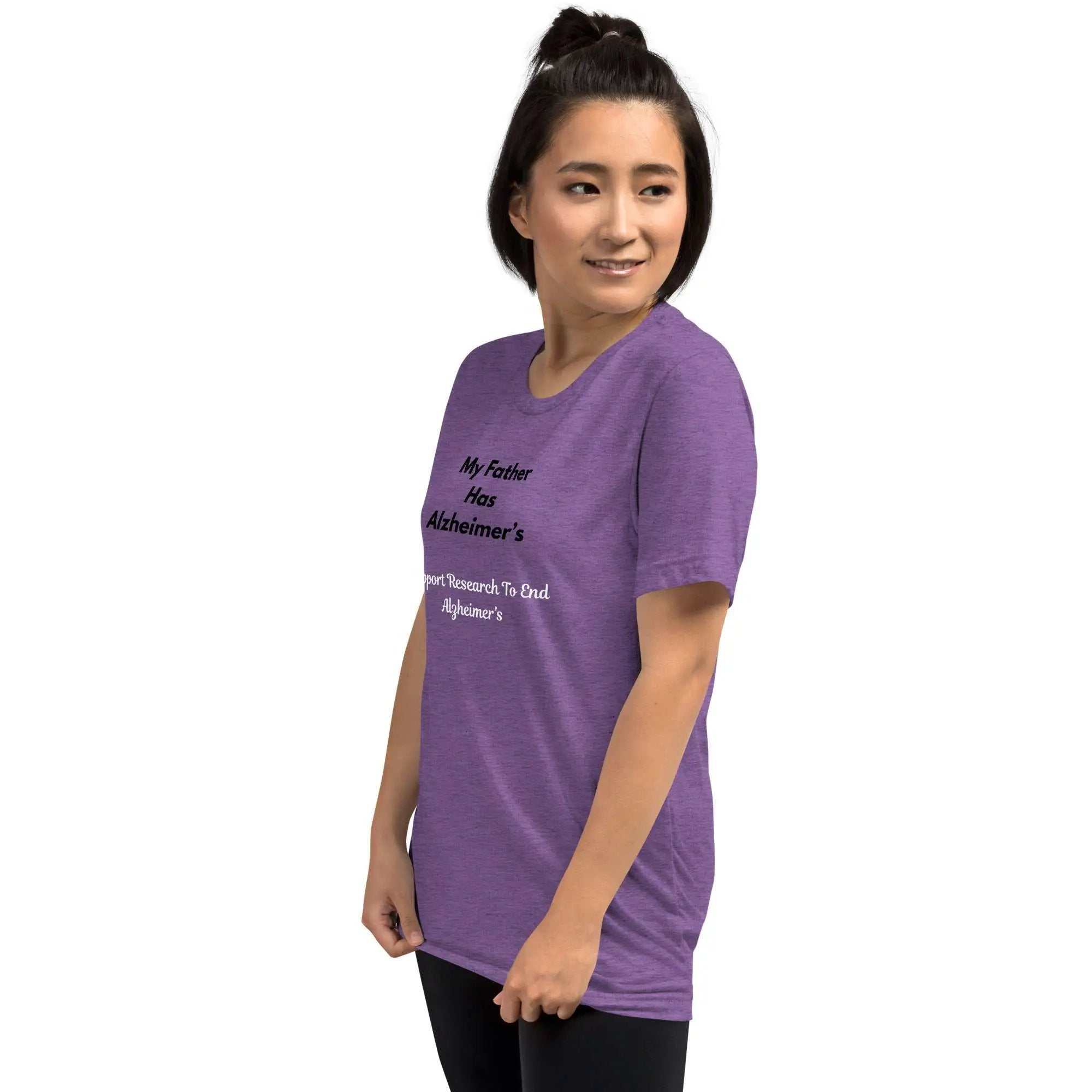 Woman wearing purple Alzheimer's Awareness shirt with My Father Has Alzheimer's text