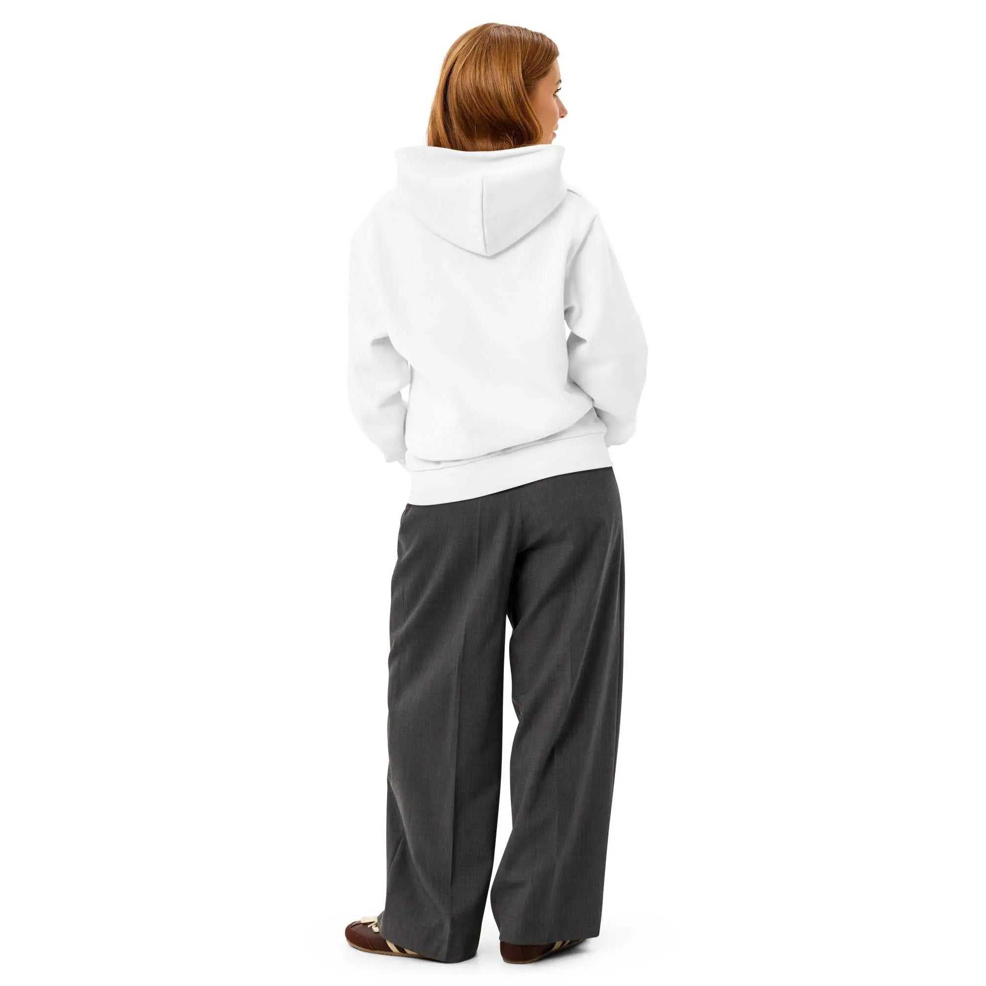 Back view of a person wearing a plain white Alzheimers hoodie with dark grey trousers