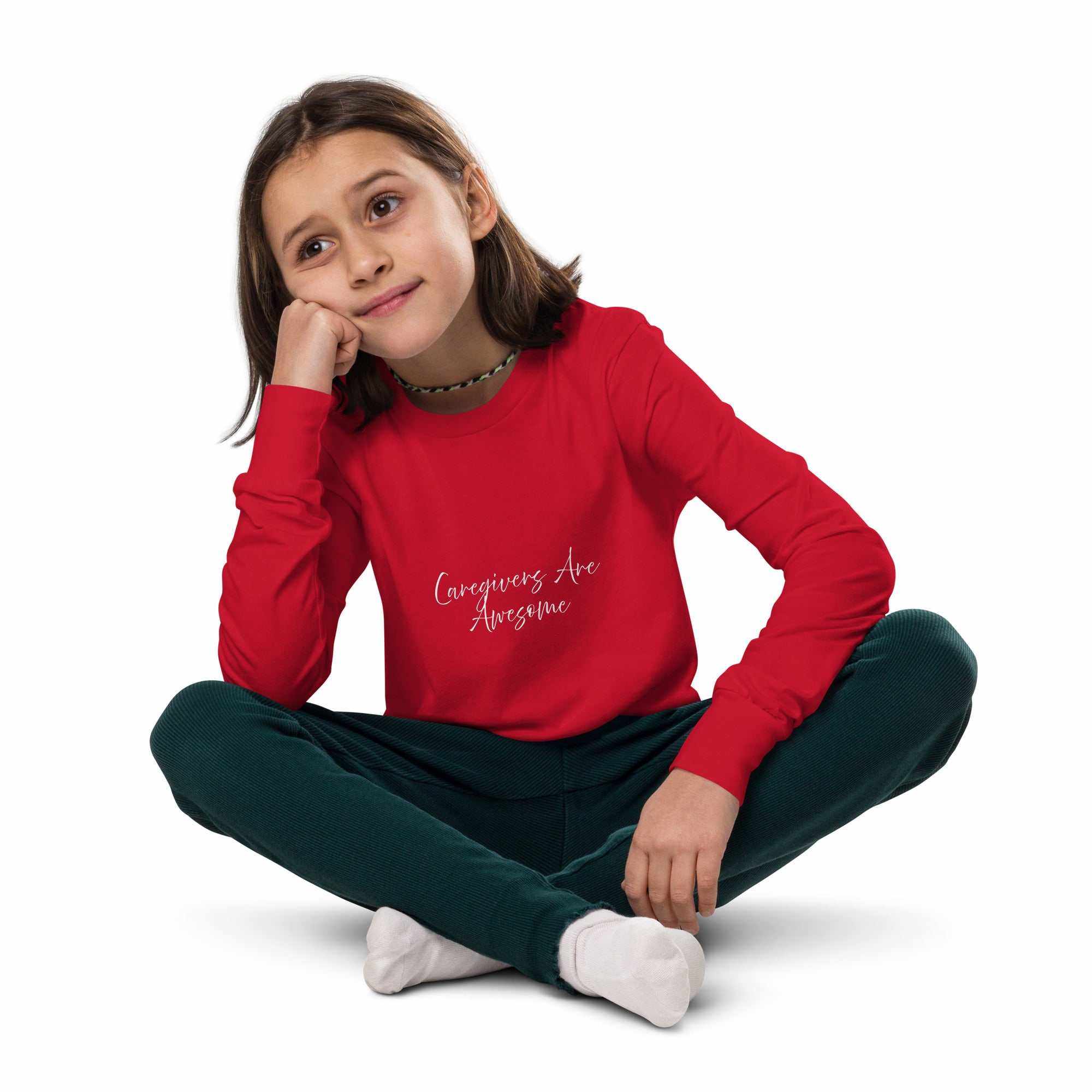 Youth unisex long sleeve tee in red with Caregivers Are Awesome text